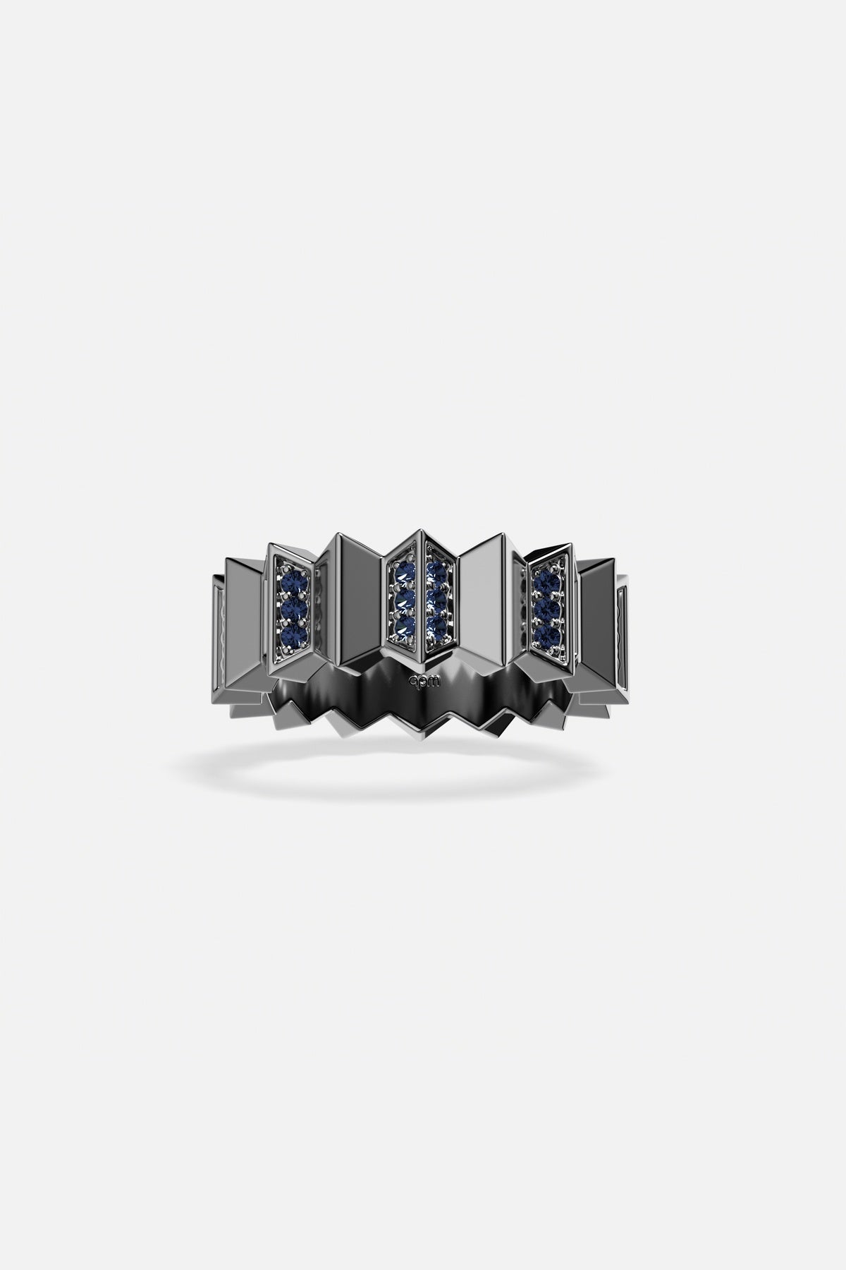 APM Ring, sculpted architecture with deep blue accents, boldly modern.