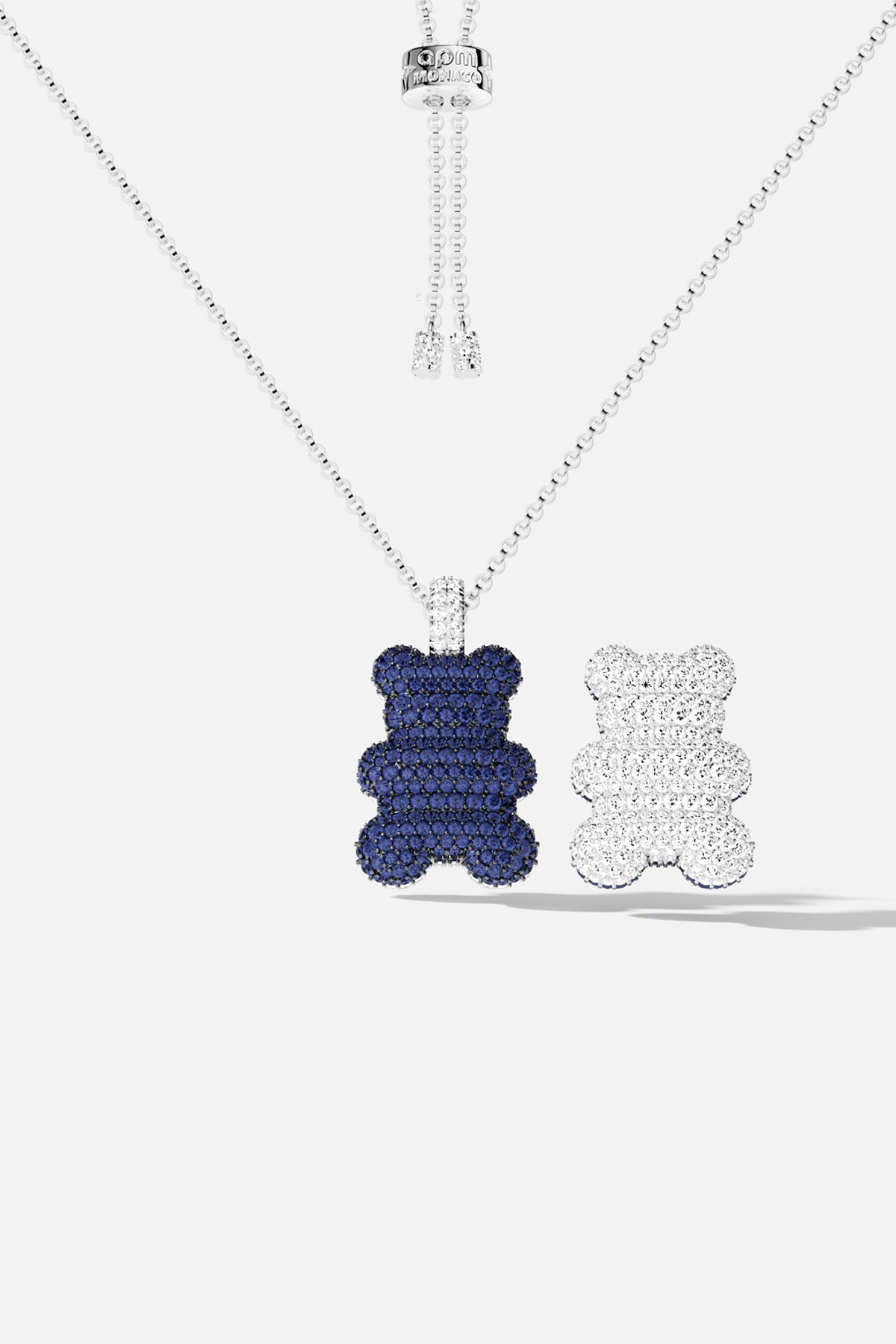 APM Yummy Bear Necklace, a playful duo in midnight blue and sparkling white.