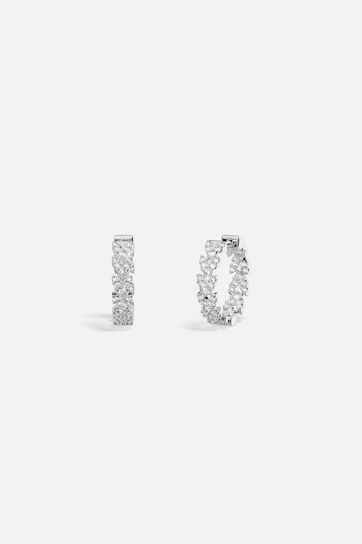 APM Hoop Earrings, a shimmering cascade of pavé brilliance in rhodium finish.