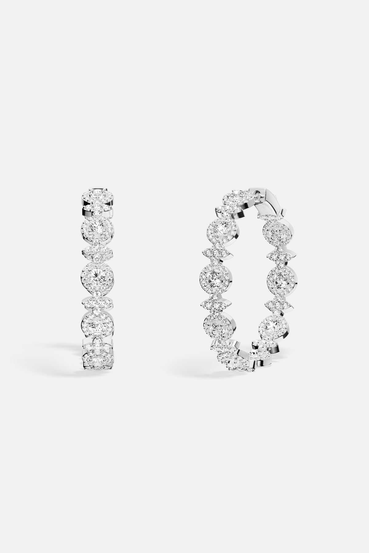 APM Hoop Earrings, a shimmering constellation of light and effortless elegance.