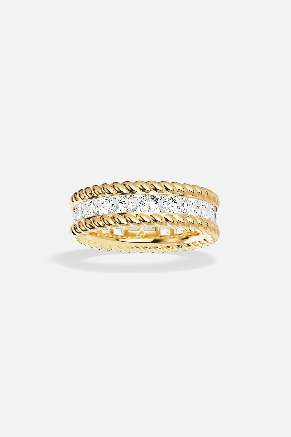 APM Ring in gold color, twisted edges framing a luminous crystal path.