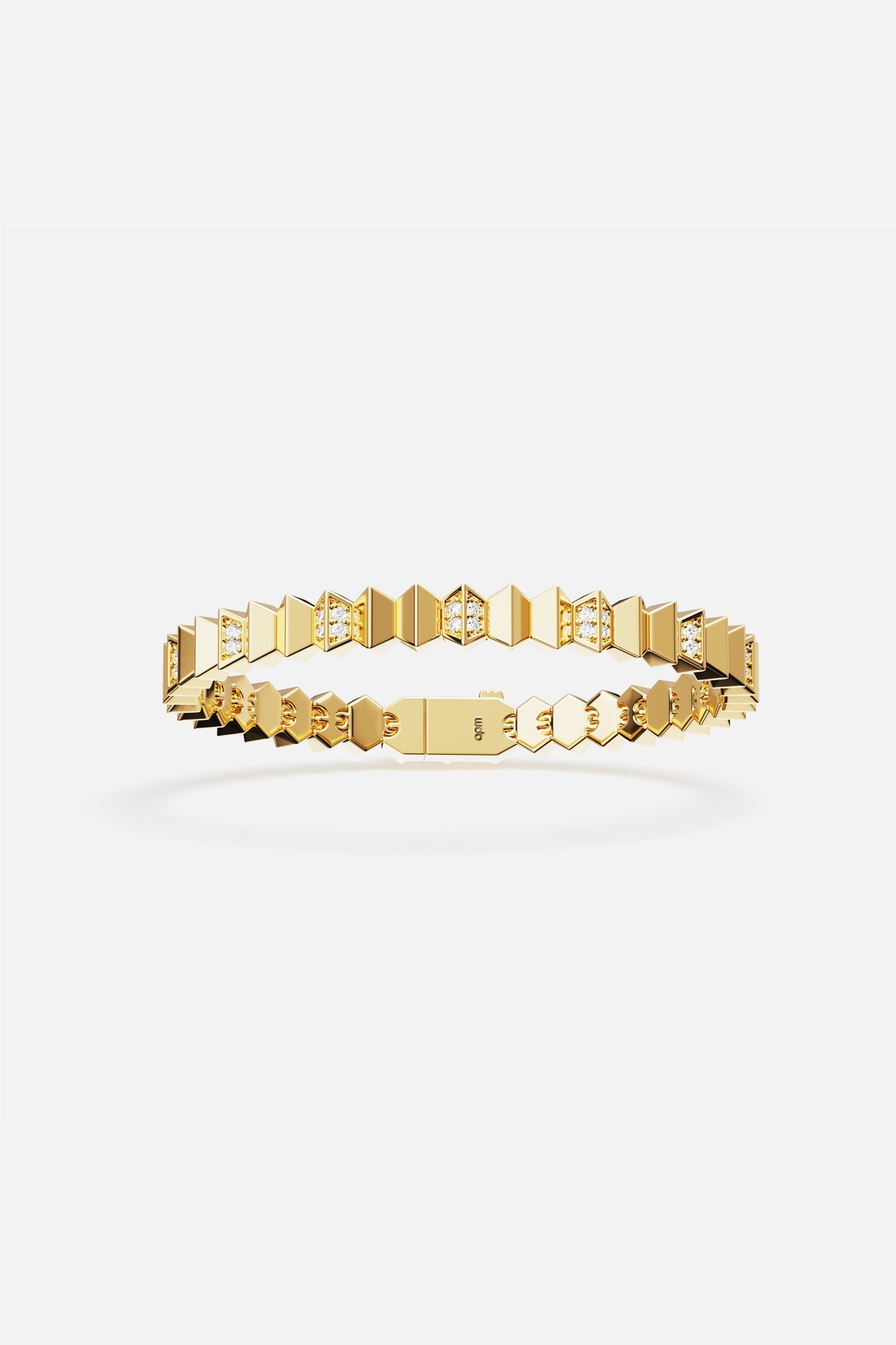 APM bracelet in golden hues, faceted geometry meets modern edge.