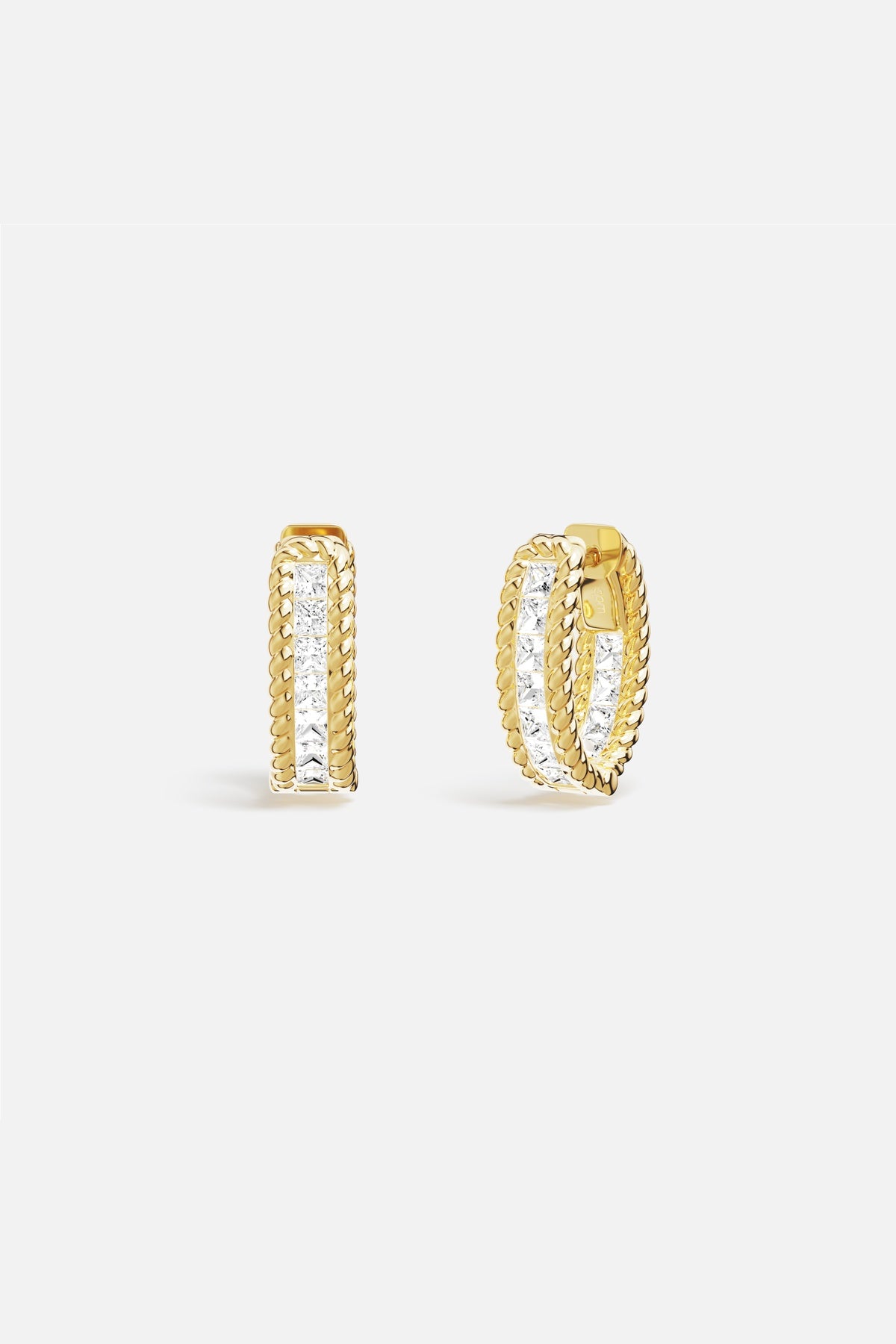APM Hoop Earrings, twisted golden ropes framing a luminous crystal line.