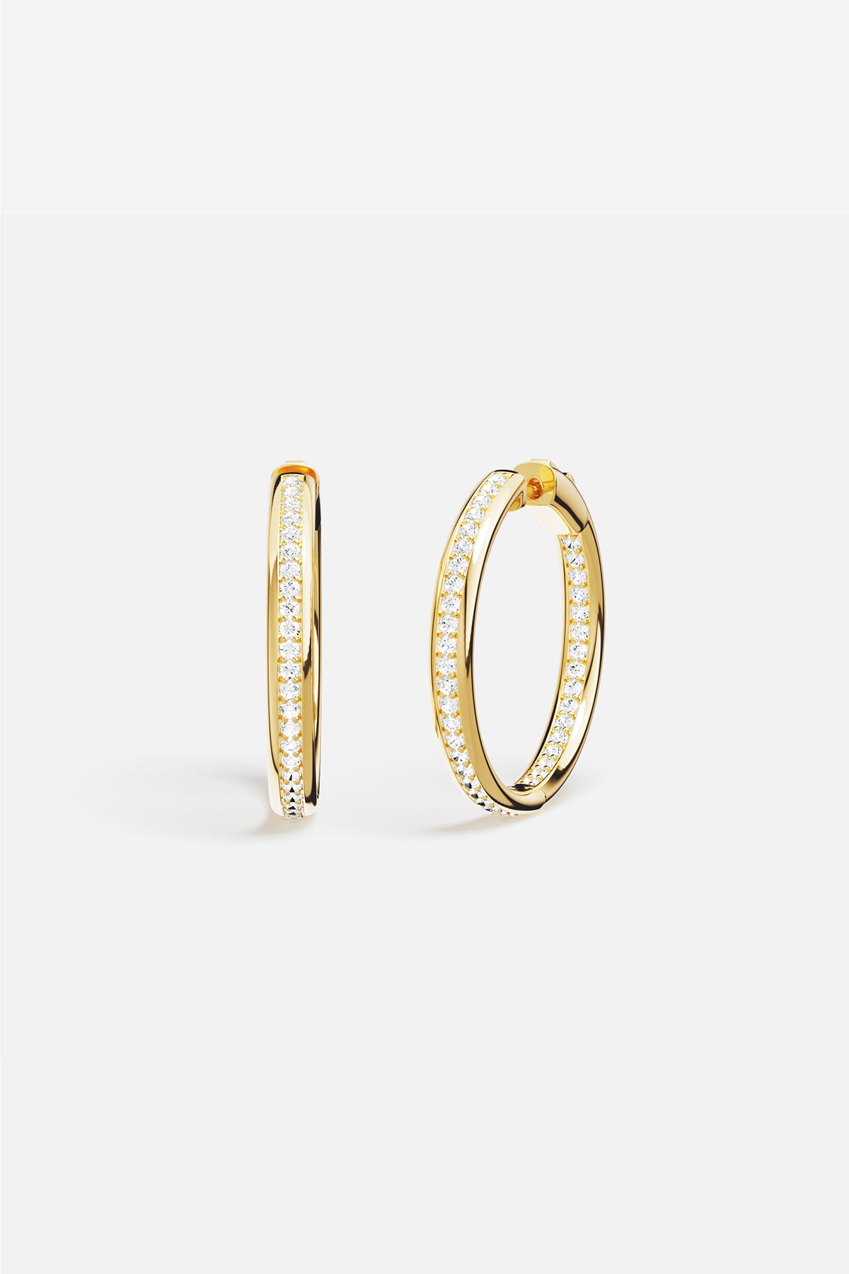 APM Hoop Earrings in golden color, radiant sparkle for effortless everyday elegance.