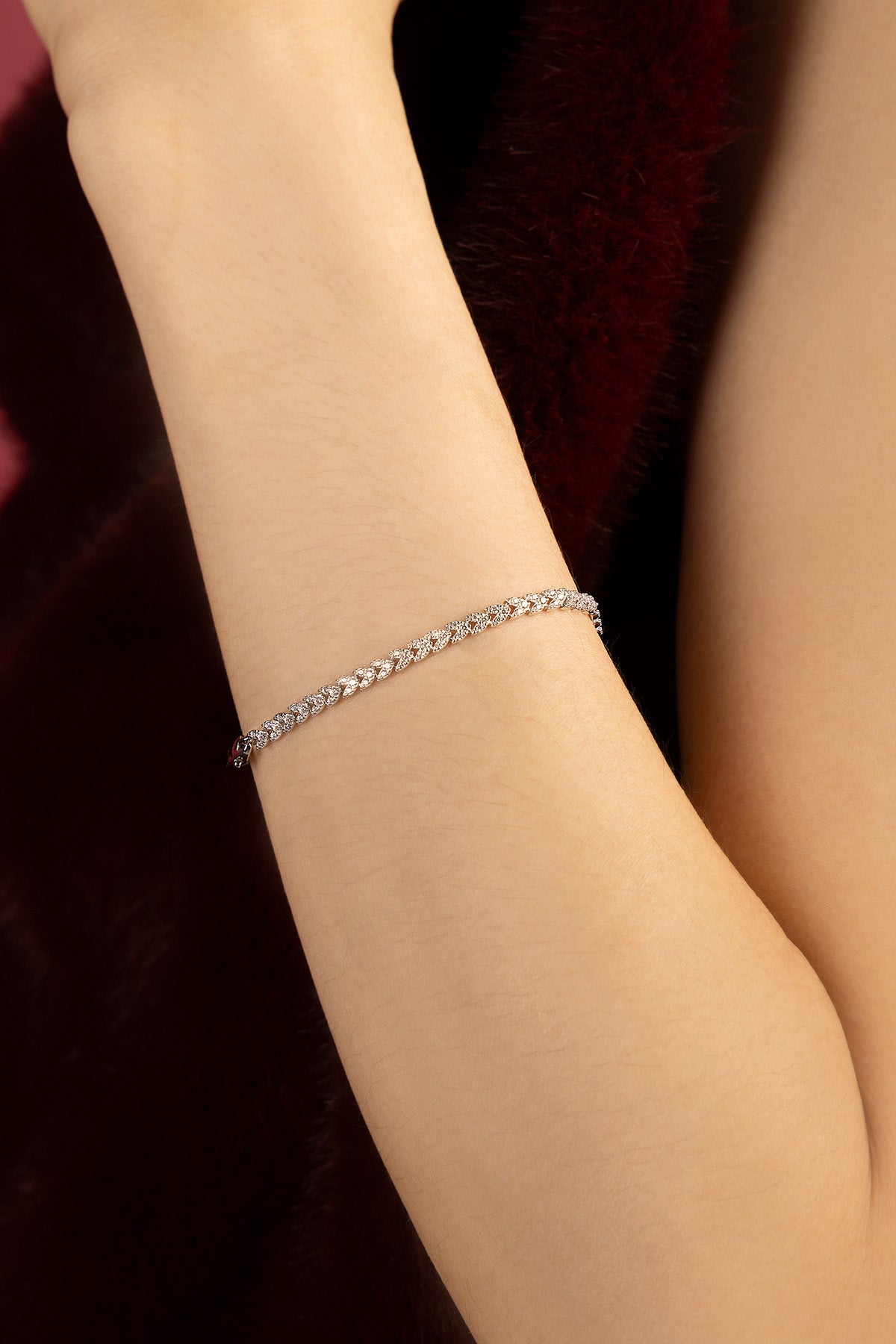 Woman wearing APM Monaco bracelet, a delicate shimmer of quiet elegance.