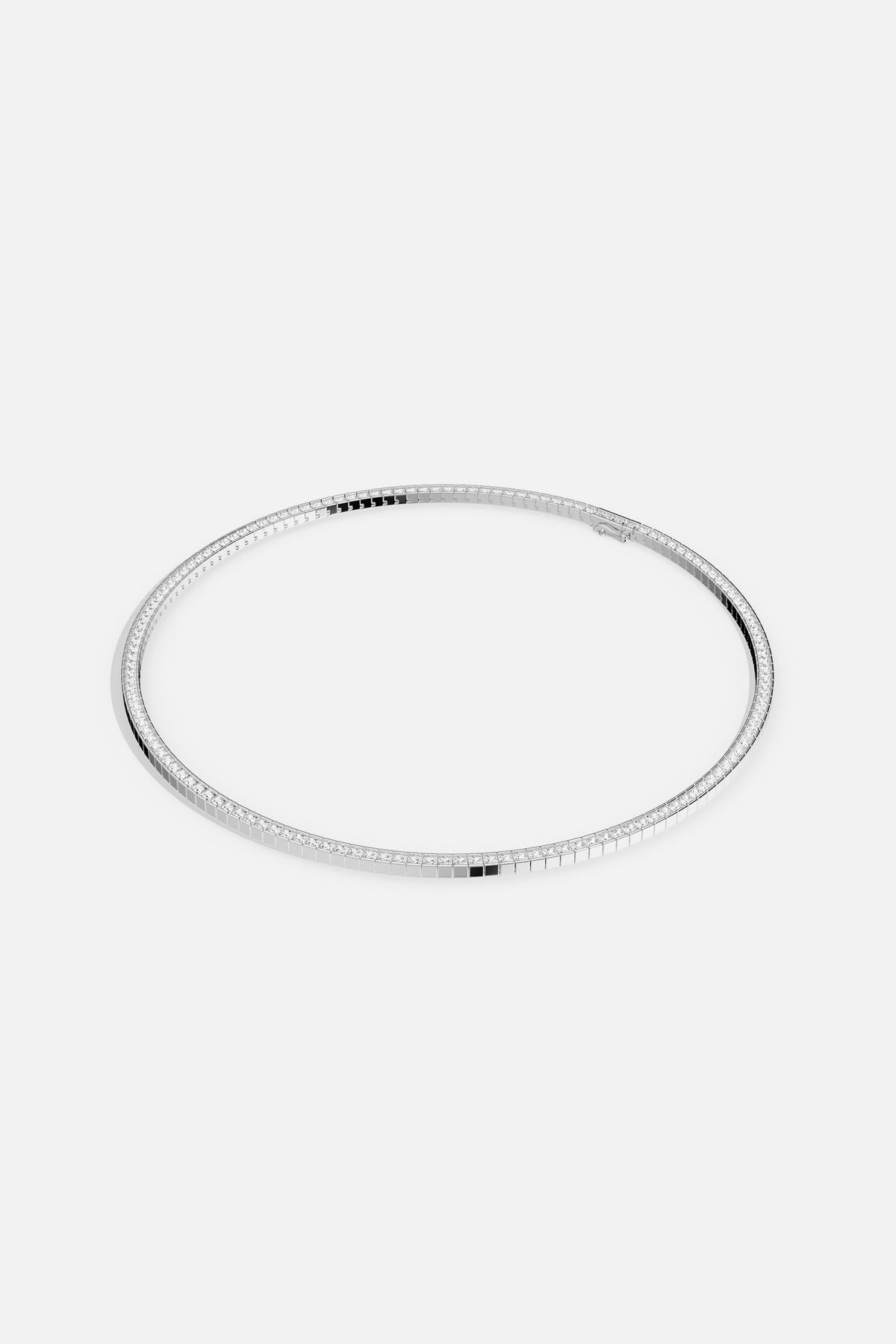 APM tennis necklace in rhodium finish, a sleek line of quiet brilliance.