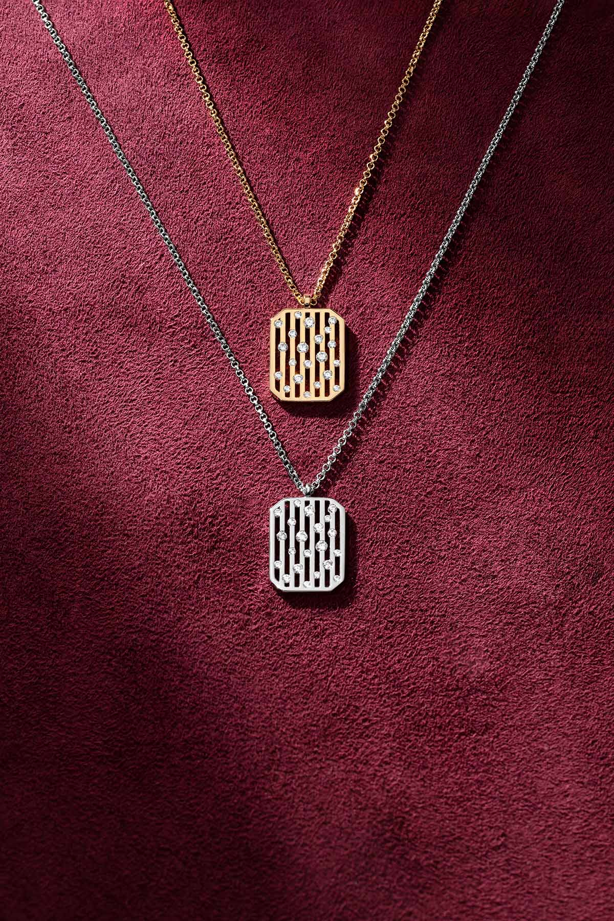 APM Morse Necklaces layered in golden and rhodium finish, a modern duet of elegance.