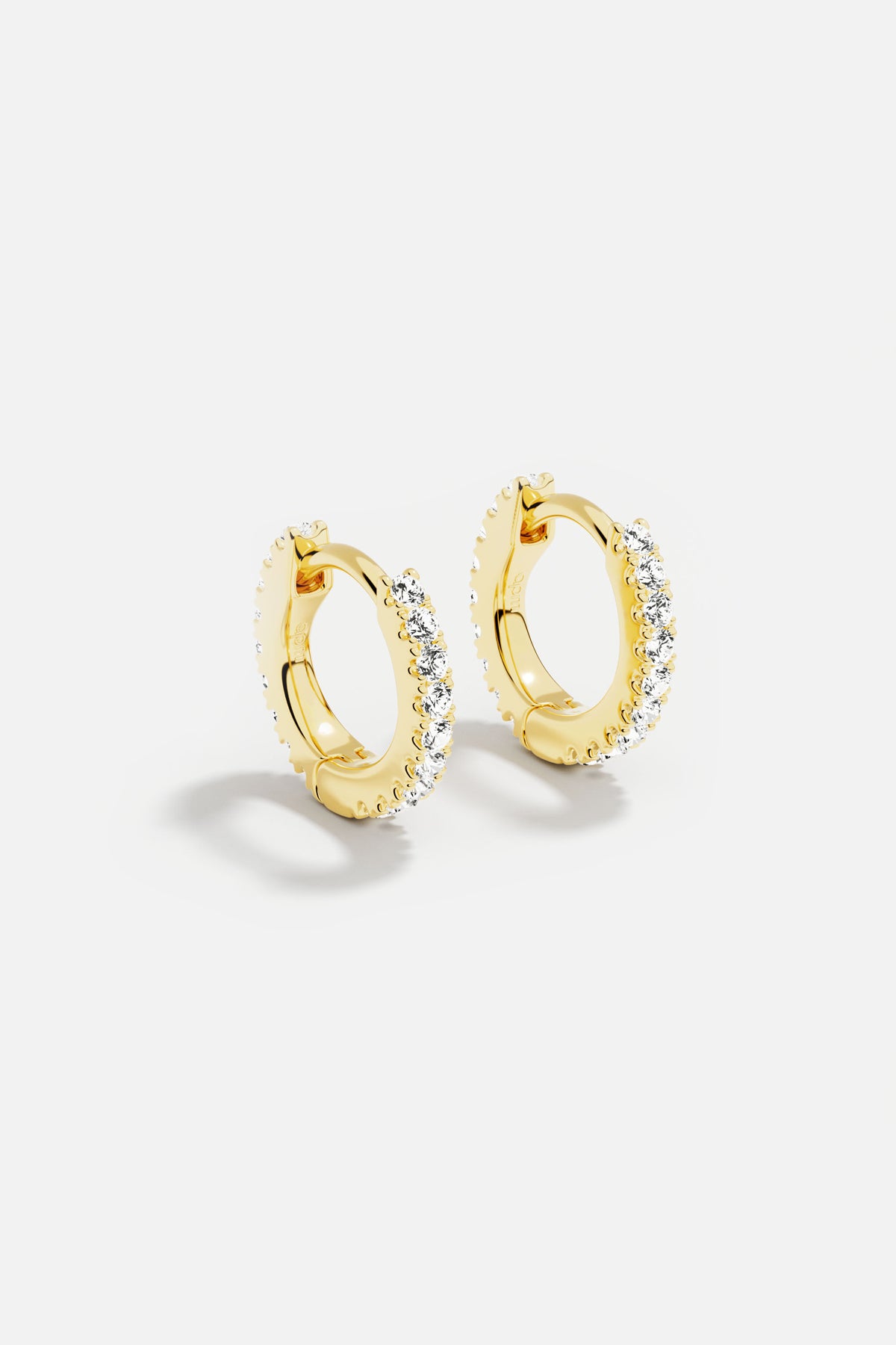 APM Hoop Earrings, golden radiance meets everyday elegance.