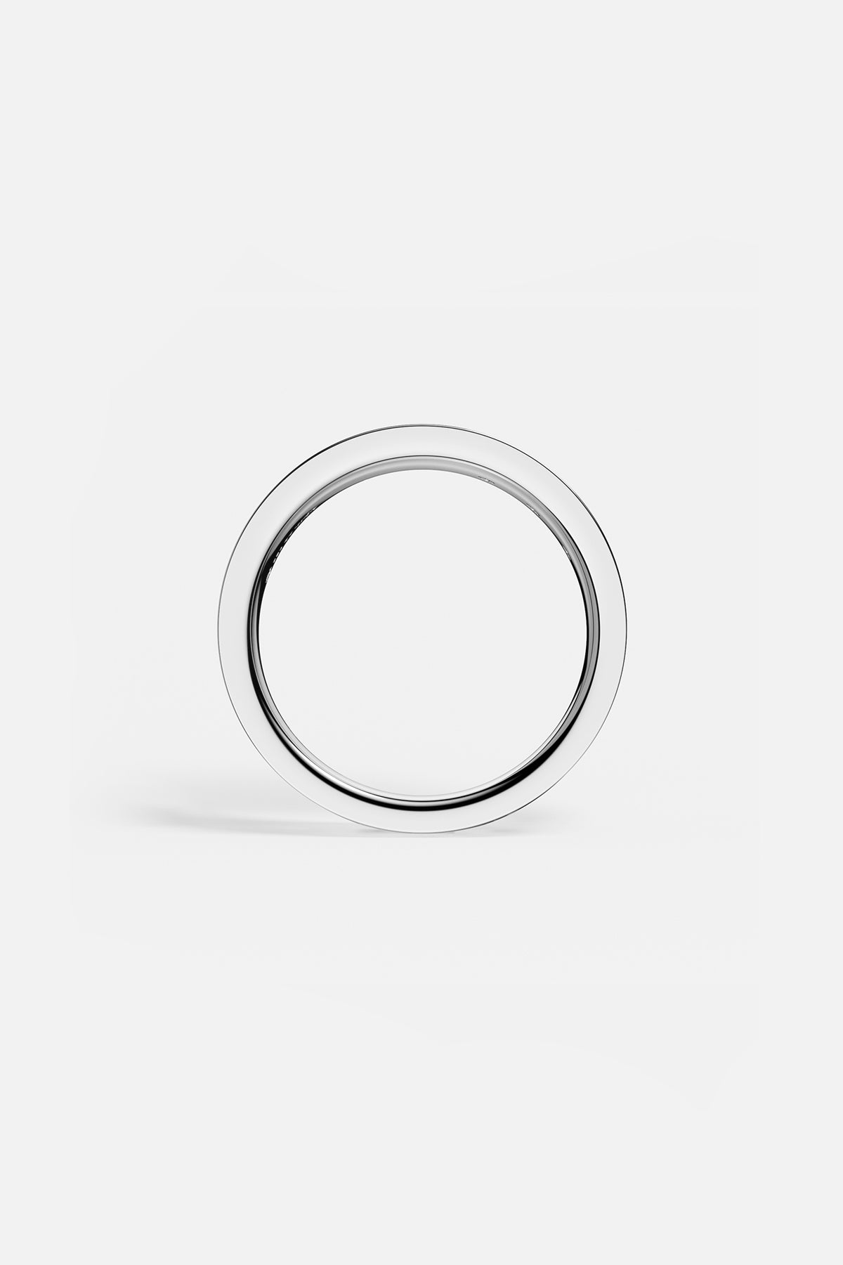APM Ring in rhodium finish, a sleek band of quiet, modern elegance.