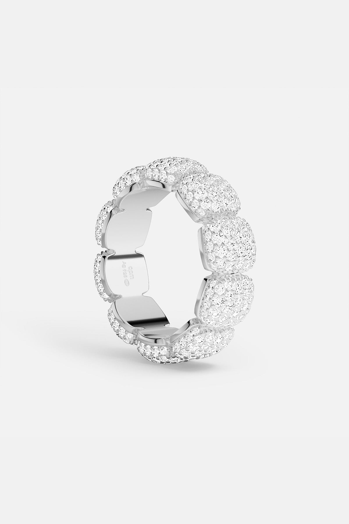 APM MONACO silver ring with embedded white stones on a white background