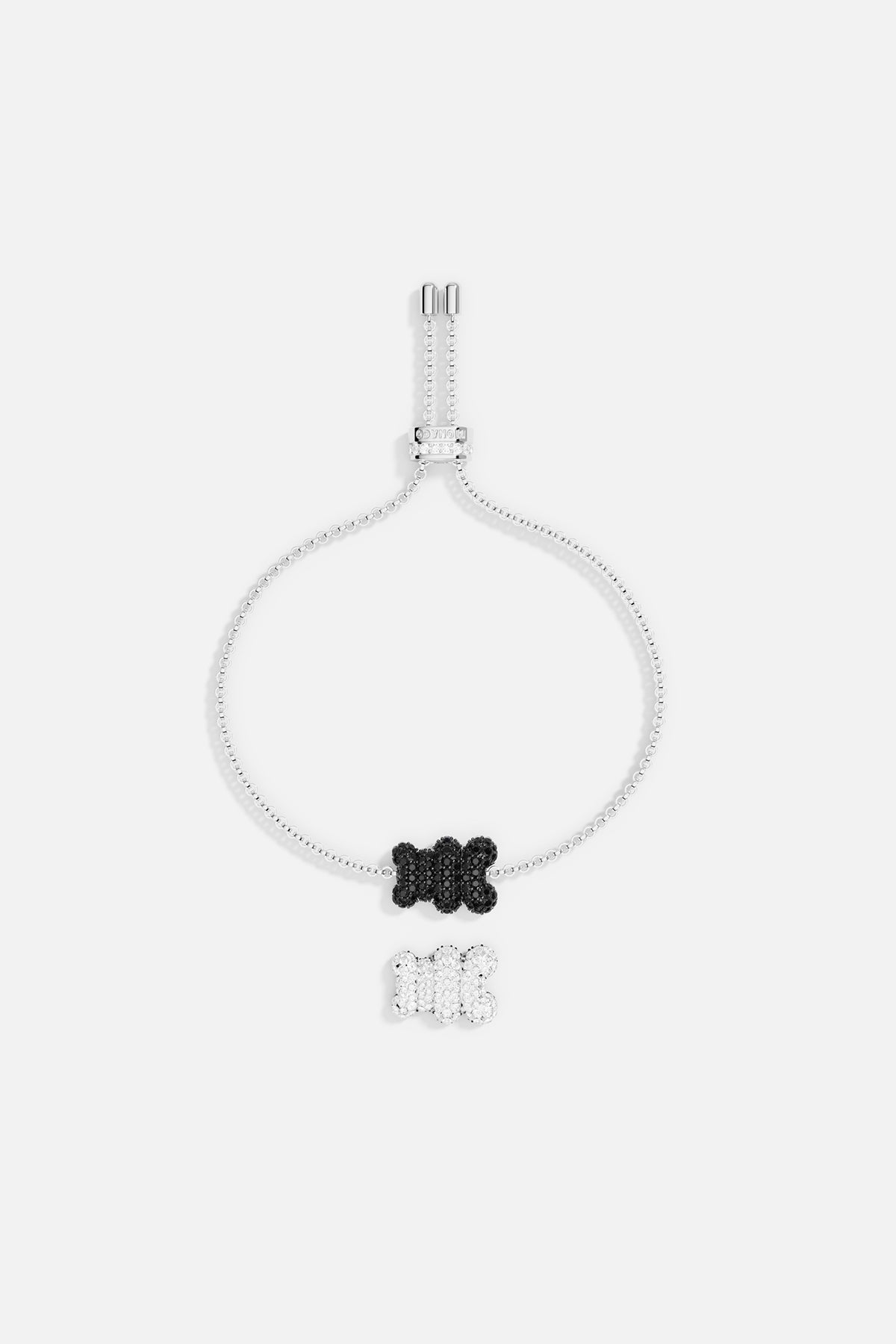 Bracelets APM Monaco adjustable with a silver chain and a black and white motif accented by diamonds.