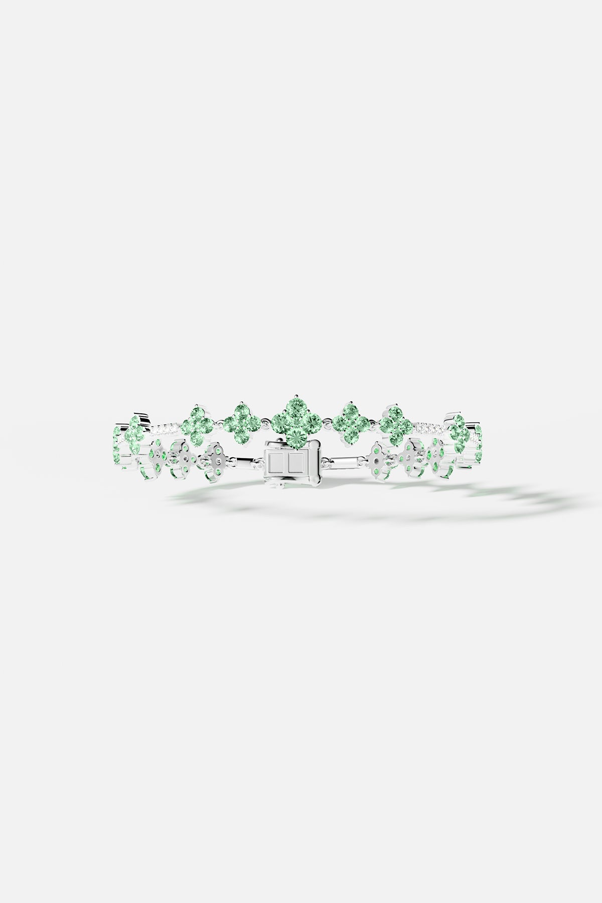 Bracelets APM Monaco. pastel-green stones set in a silver pavé bracelet.