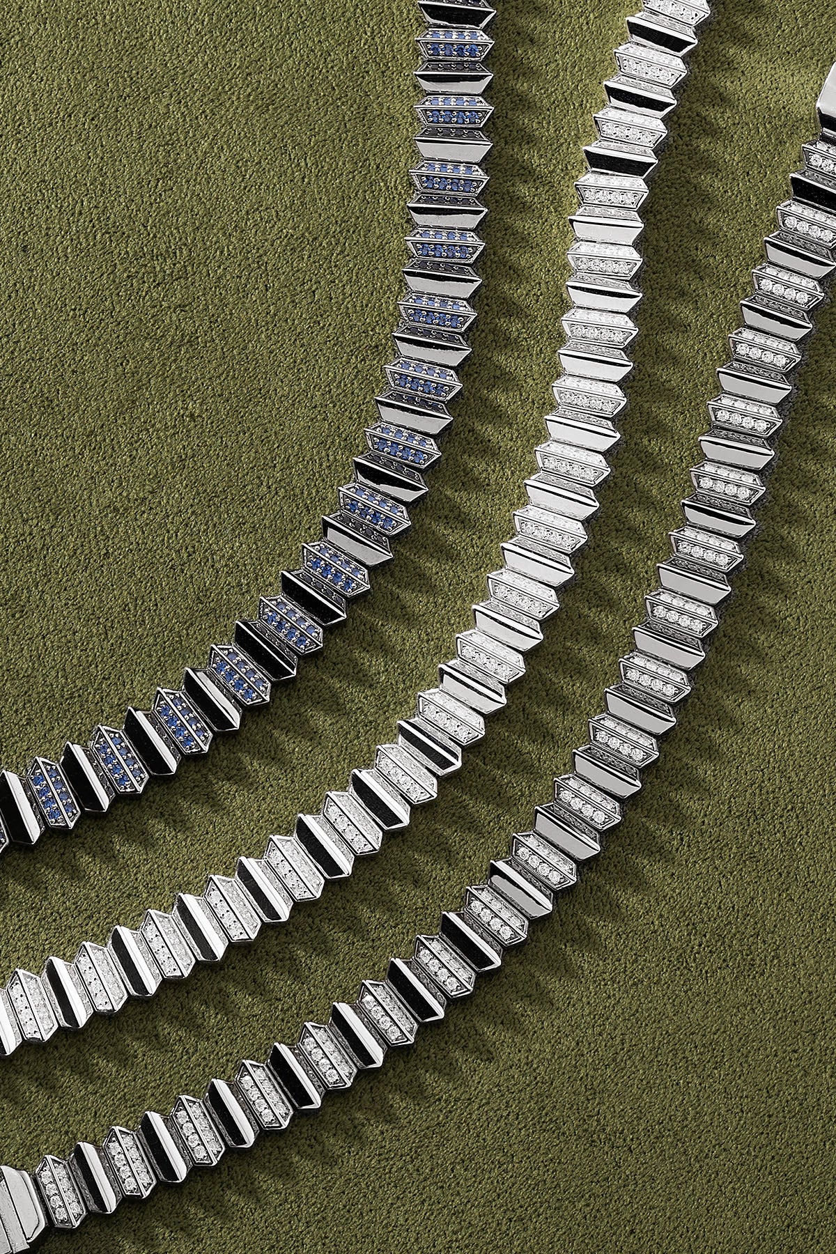 APM Monaco Up and Down Bracelet in silver on a green background