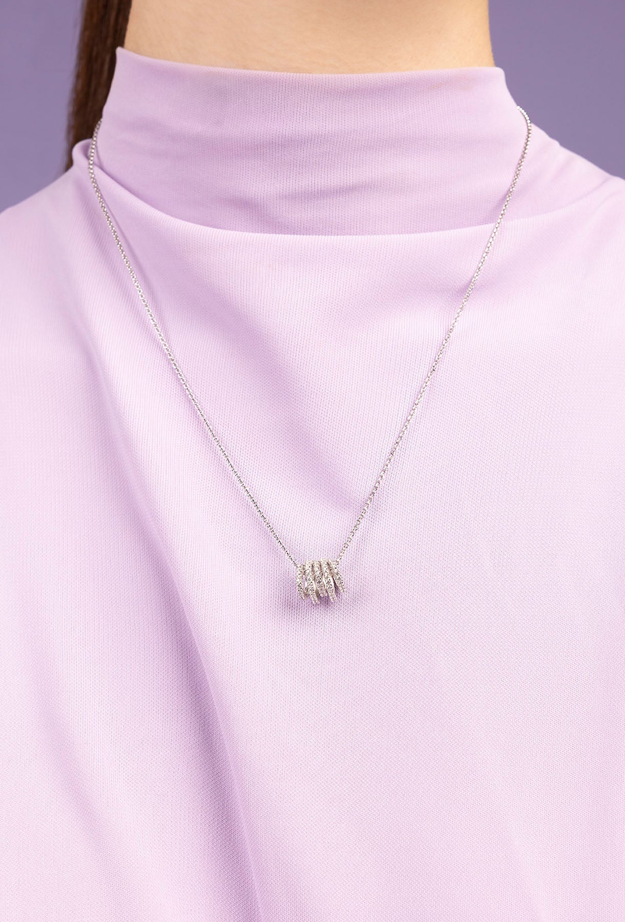 APM MONACO silver necklace with hoop adjustable design worn on model