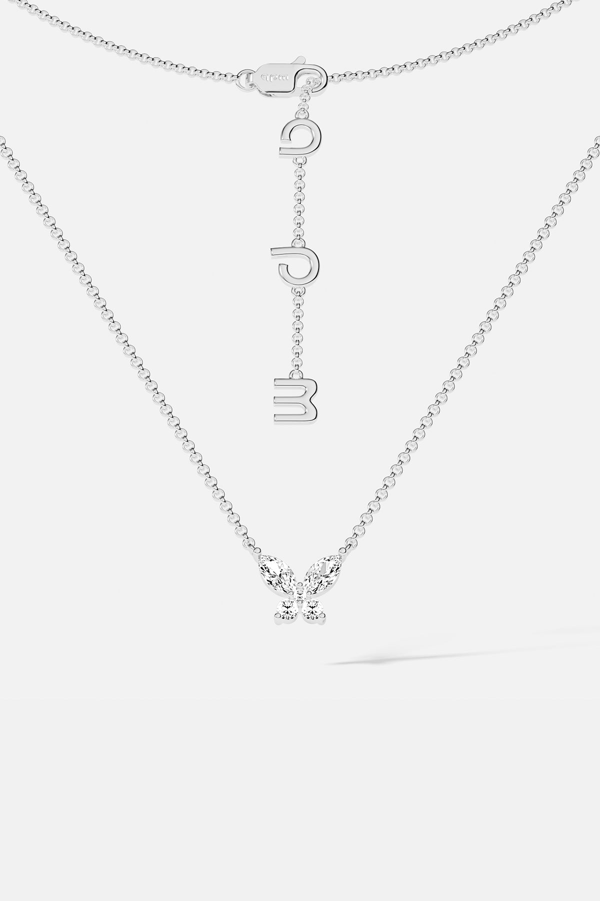 Necklaces APM Monaco. White gold butterfly necklace with white cubic zirconia on a silver chain; butterfly pendant and APM clasp.