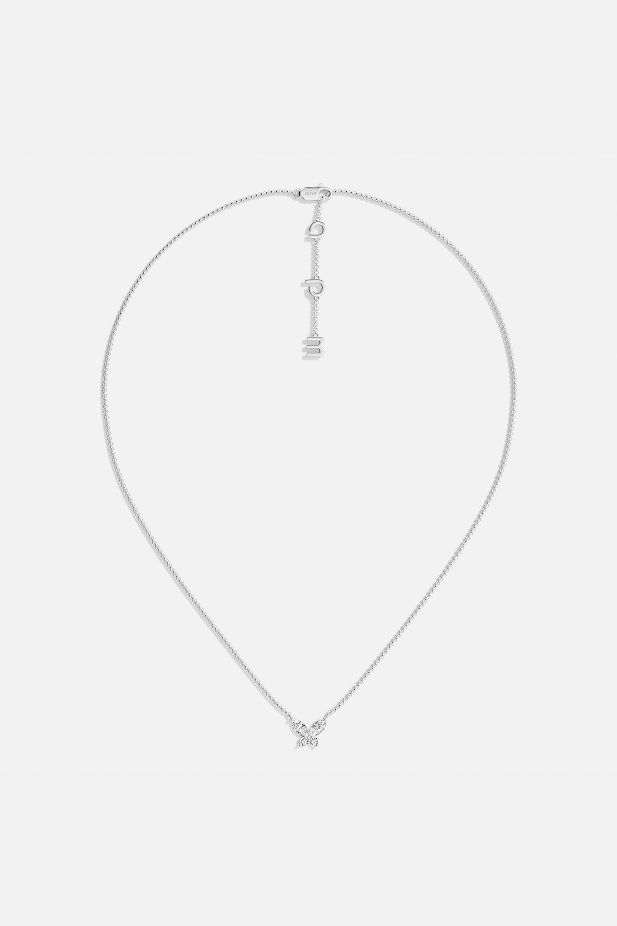 Necklaces APM Monaco. White gold butterfly necklace with white cubic zirconia on a silver chain; butterfly pendant and APM clasp.