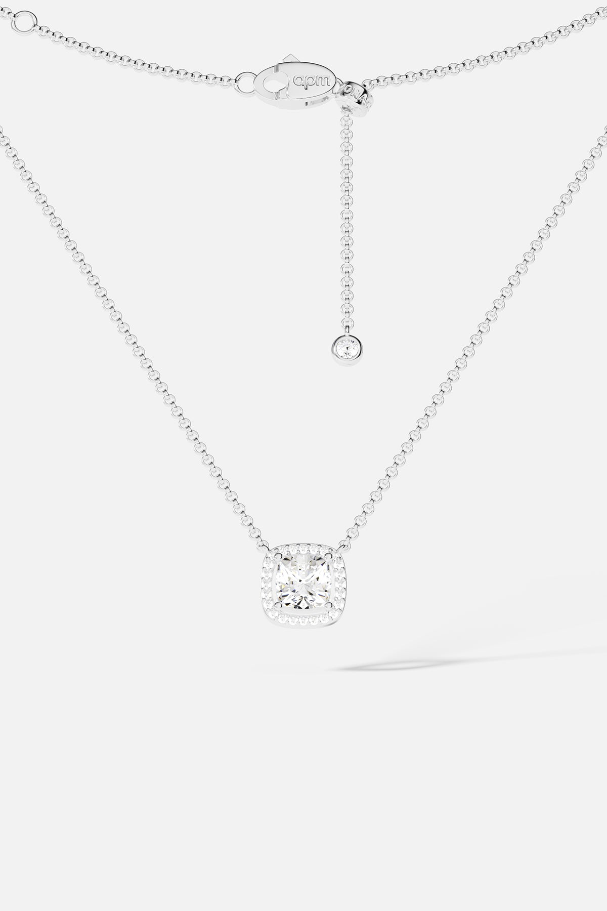 Necklaces APM Monaco: silver-tone adjustable chain necklace with a cushion-cut clear crystal pendant and extender.