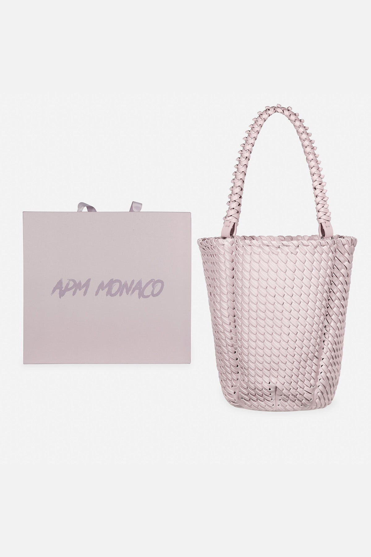 APM MONACO lavande bucket handbag with 'APM Monaco' branding next to a matching lavande box on a white background.
