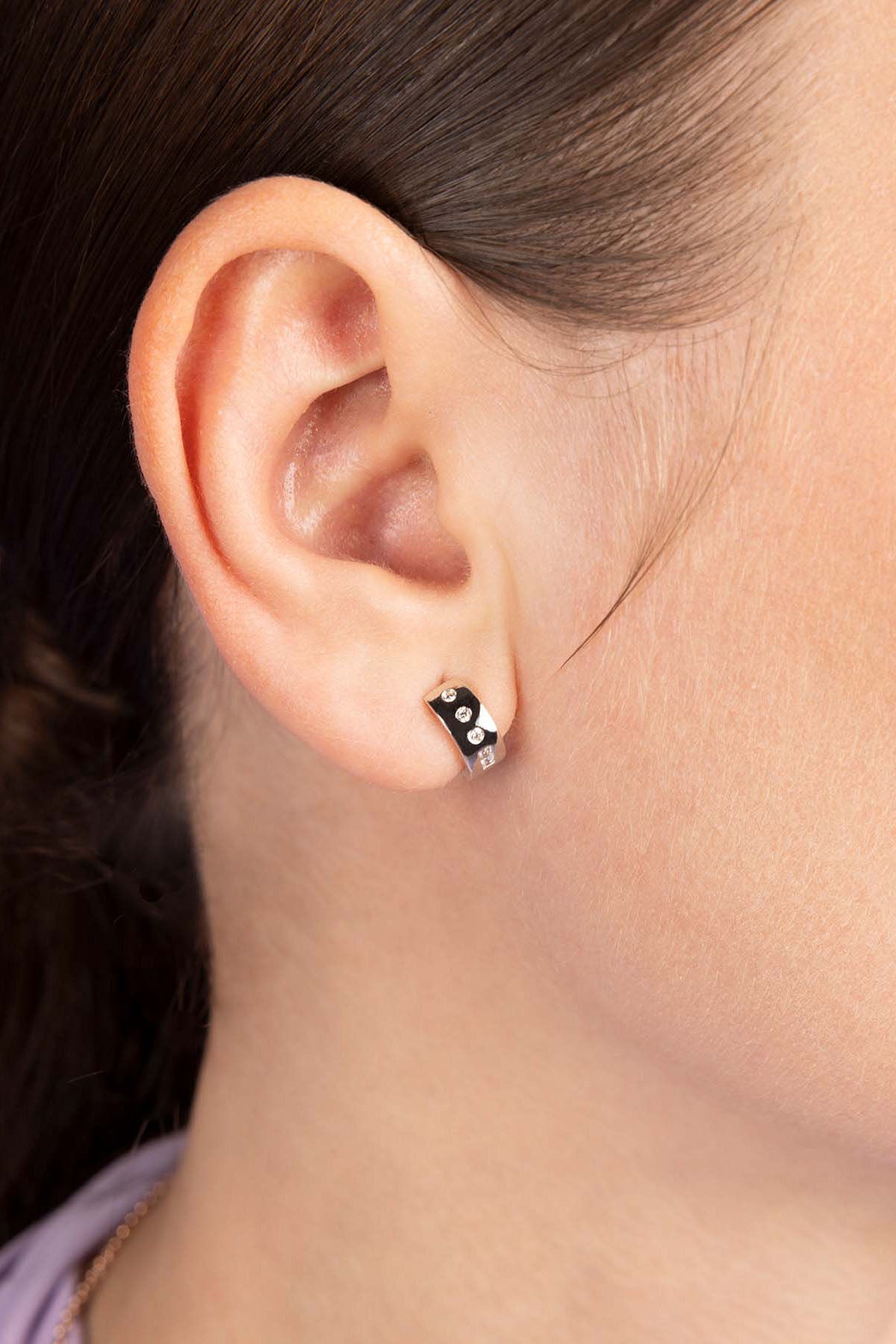 APM Monaco LOVE Morse Code Huggie Earrings worn on model