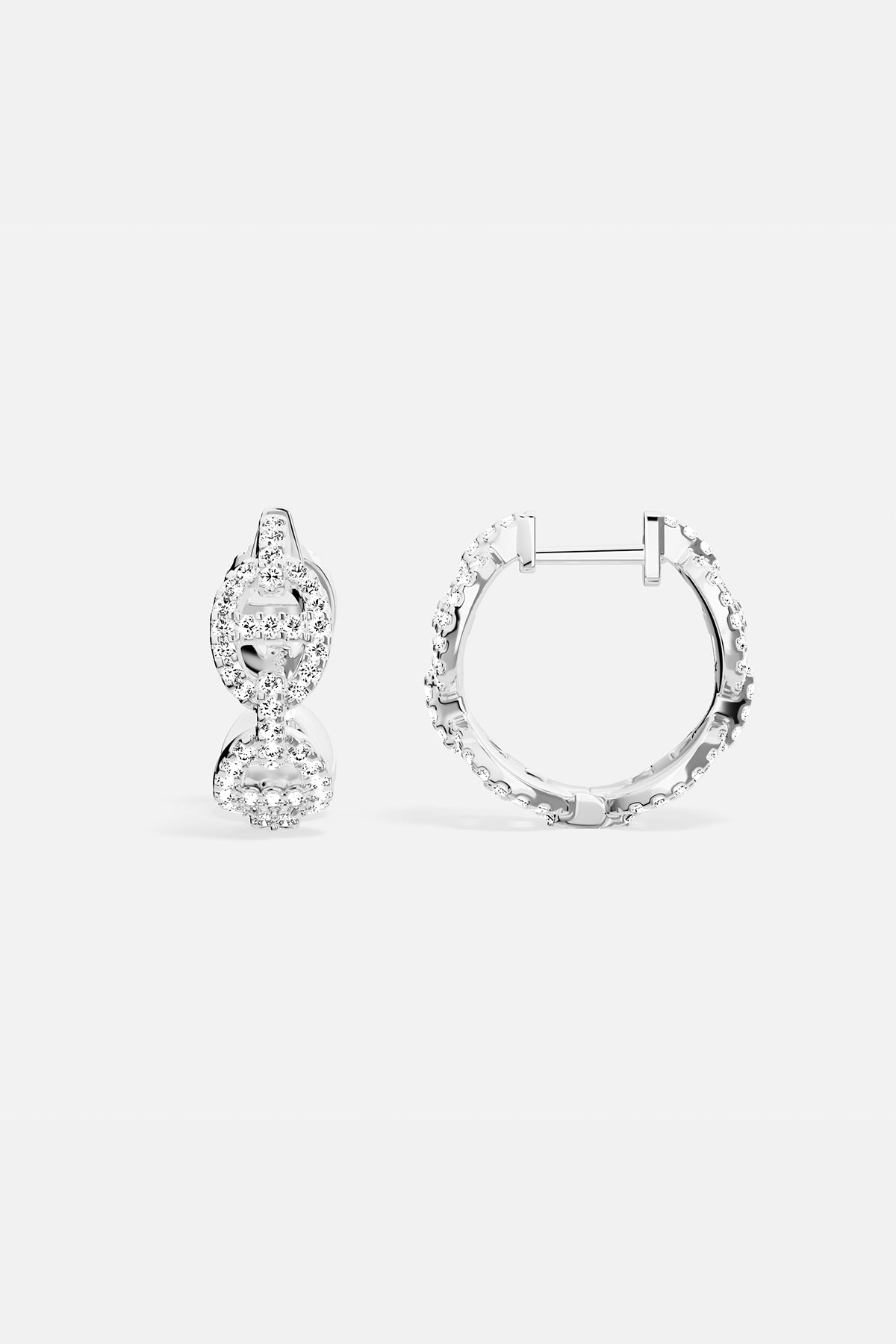Earrings APM Monaco, silver-tone hoop earrings encrusted with white cubic zirconia.