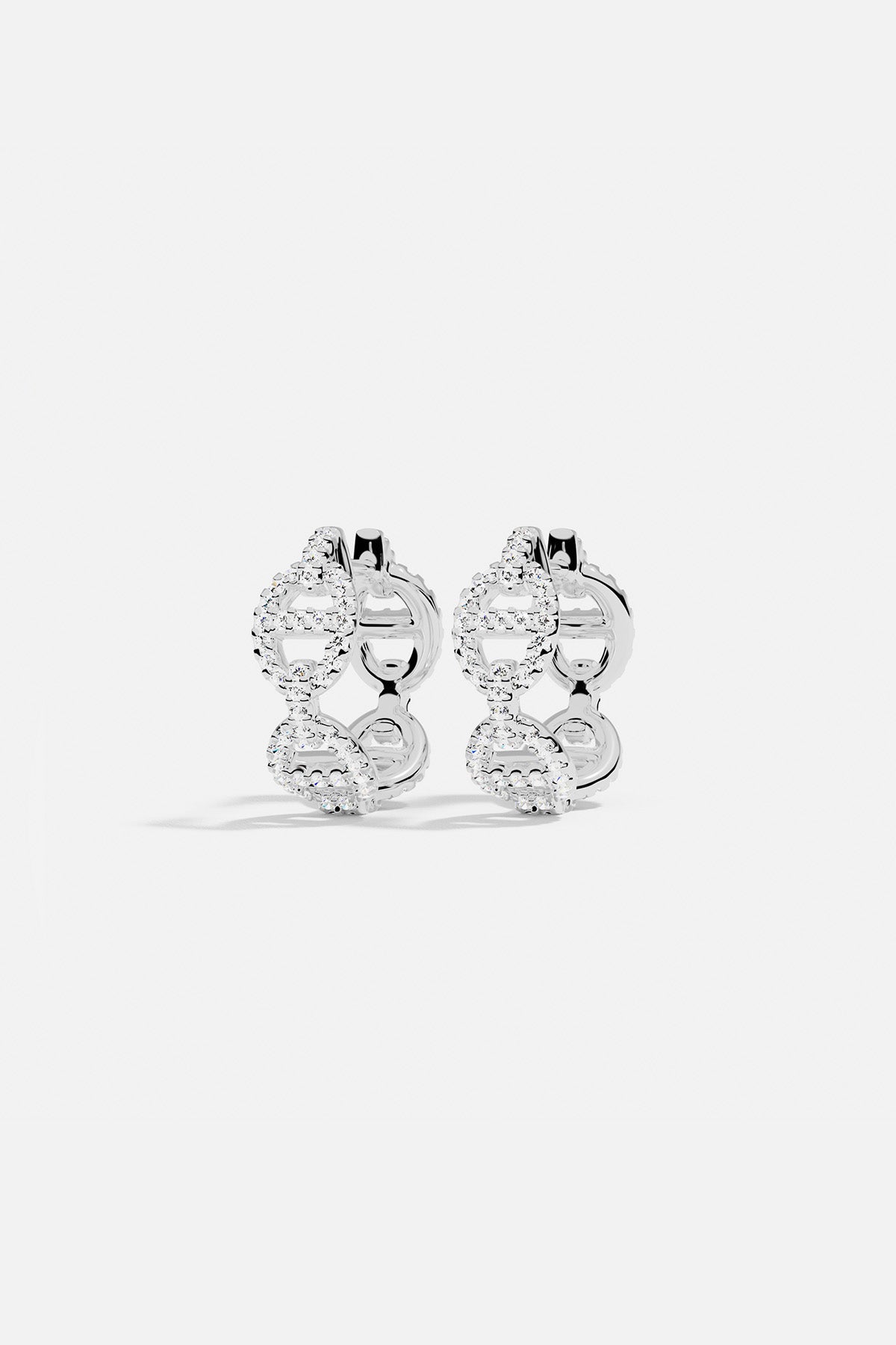 Earrings APM Monaco, silver-tone hoop earrings encrusted with pavé diamonds.