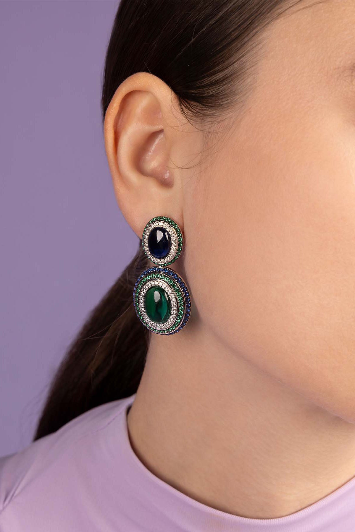 APM Monaco Bold Green and Blue Earrings Worn on ear