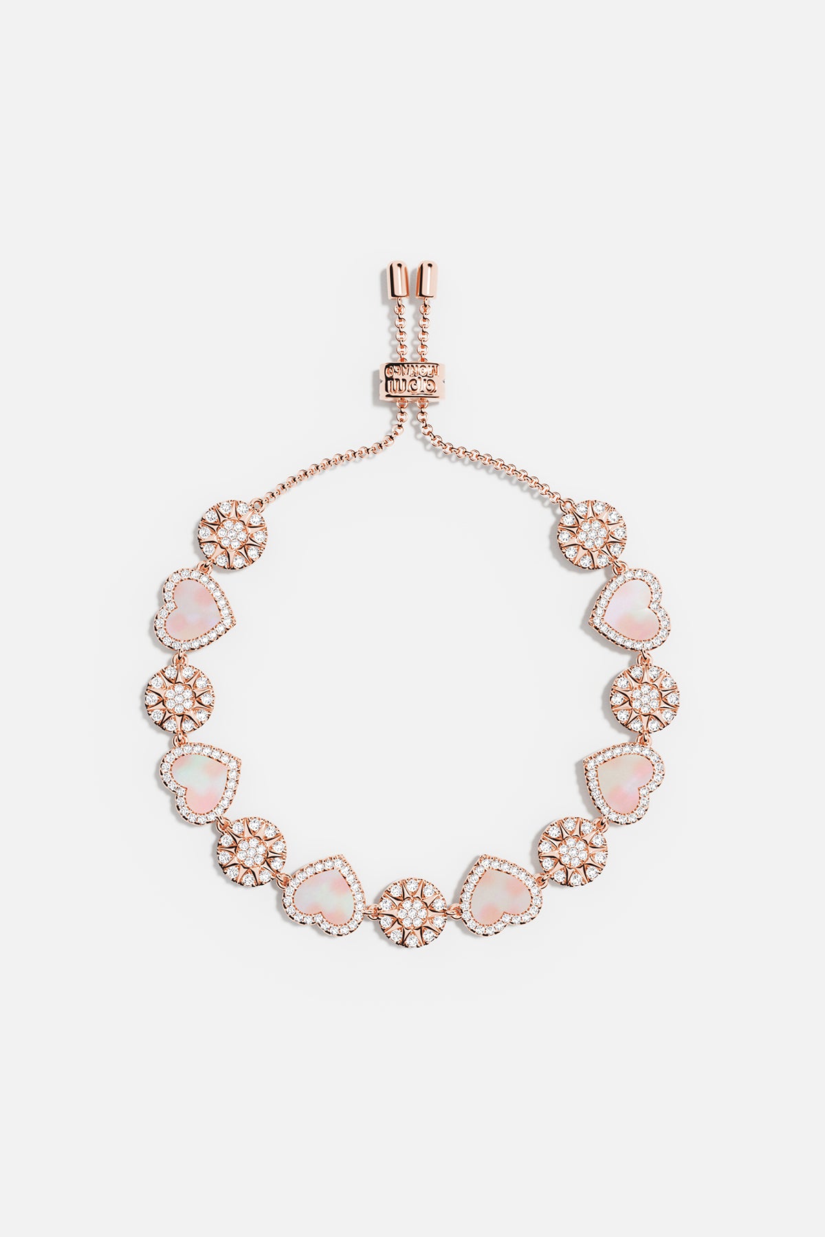 Bracelets APM Monaco, rose gold slider bracelet with pink nacre heart and dot accents, adjustable design.