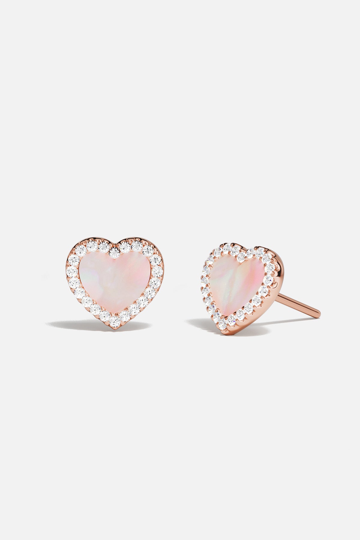 Earrings APM Monaco rose gold heart-stud with pink nacre.