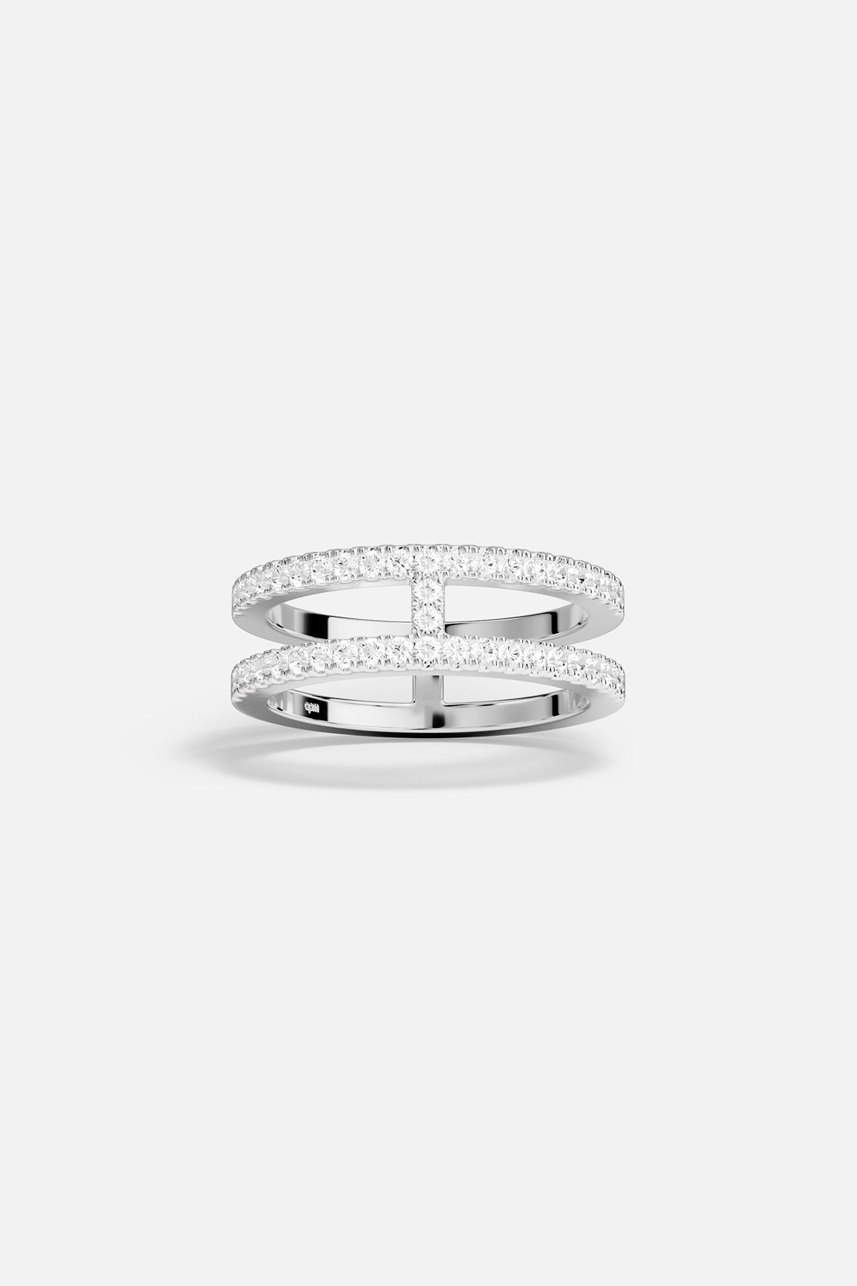 Rings APM Monaco: silver-toned ring with double pavé rows of small clear stones and two horizontal bars.