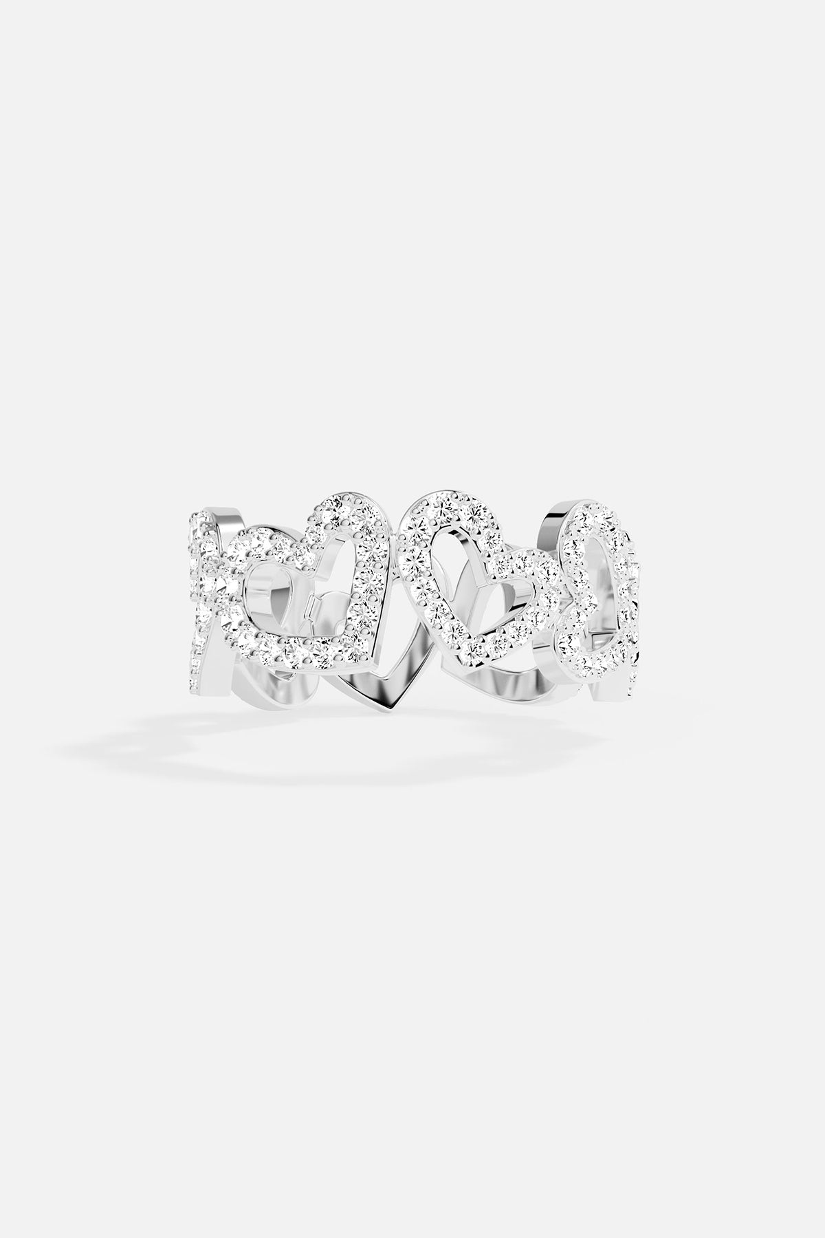 white alloy heart ring on grey background