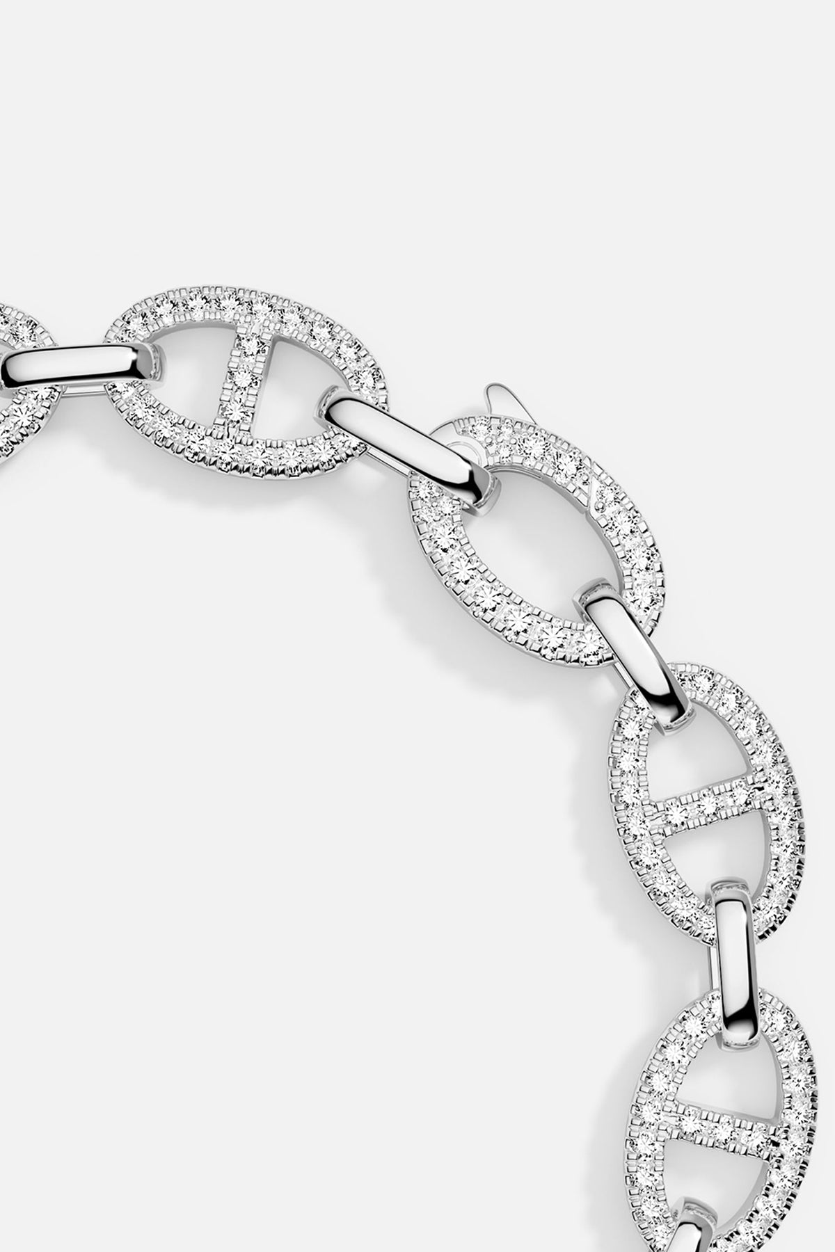 Silver bracelet with interlocking links on a light gray background