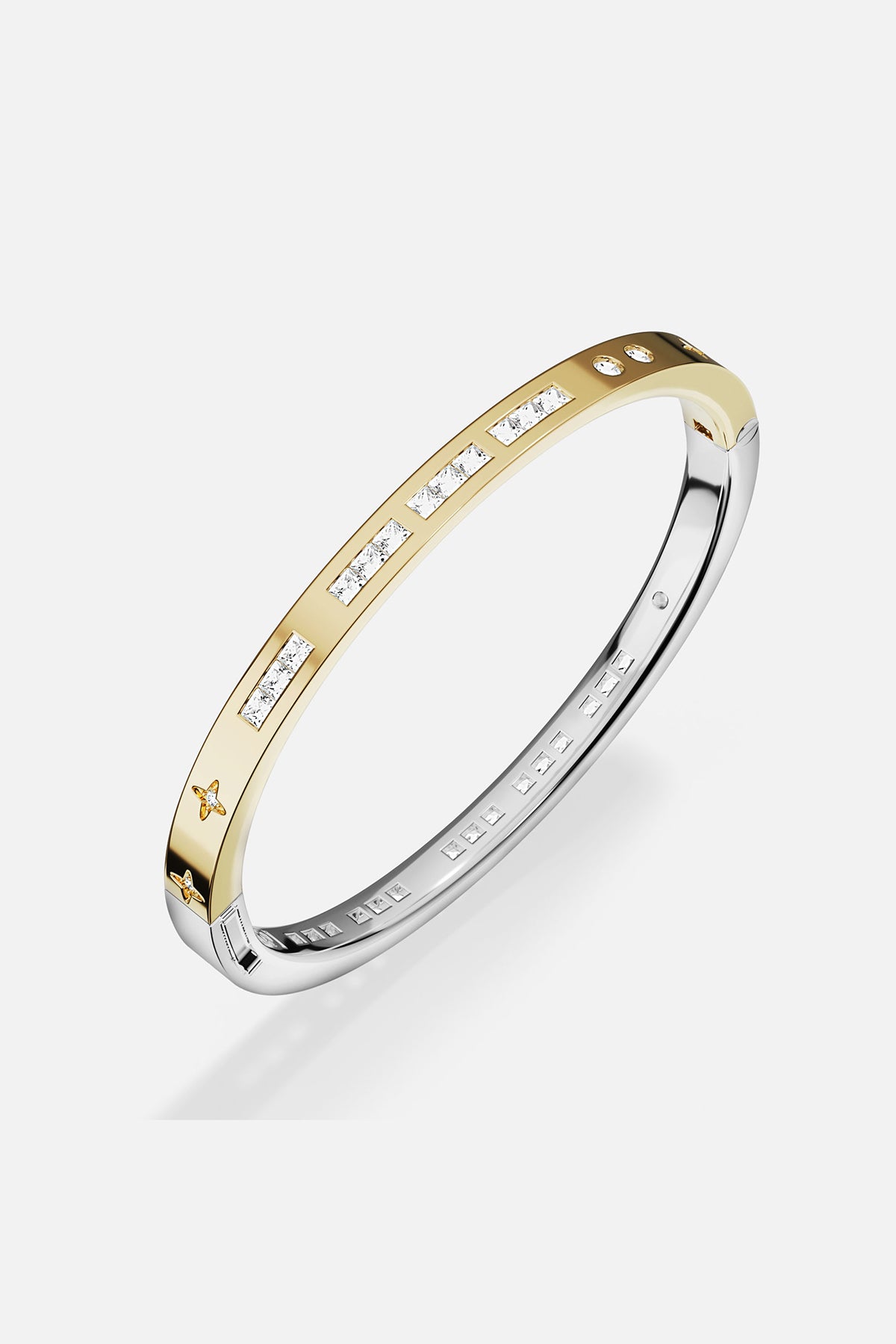 Two-toned ring with stones accents on a white background