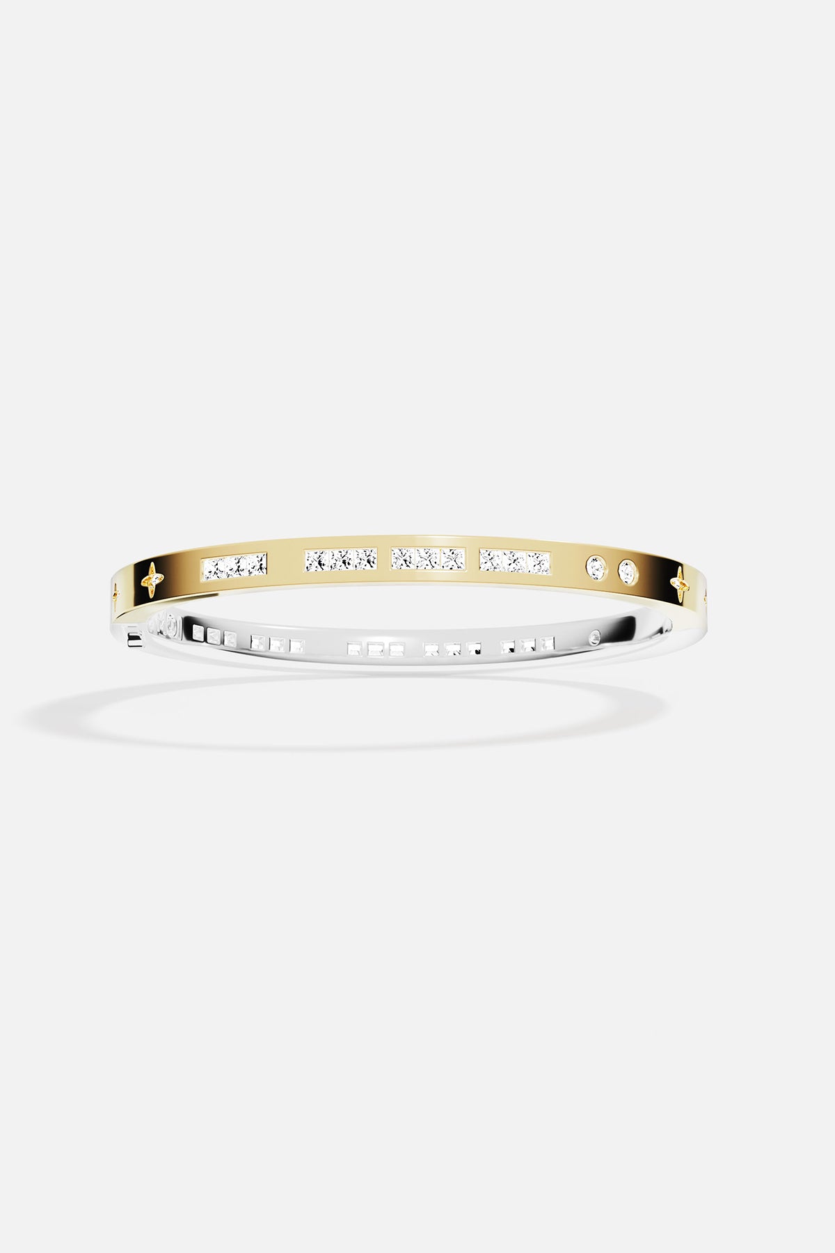 Gold bracelet with small stones on a white background