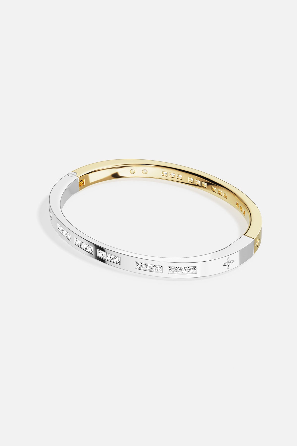 Two-toned ring with rose gold and silver band on a white background