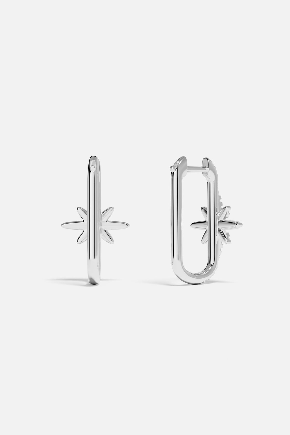 Earrings APM Monaco, silver-tone pair featuring a star-shaped and a U-shaped design.