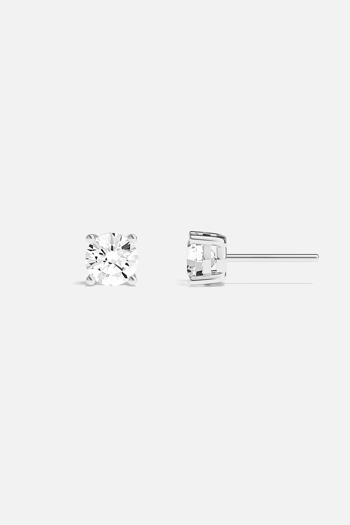 Earrings APM Monaco round stud earrings with white cubic zirconia.
