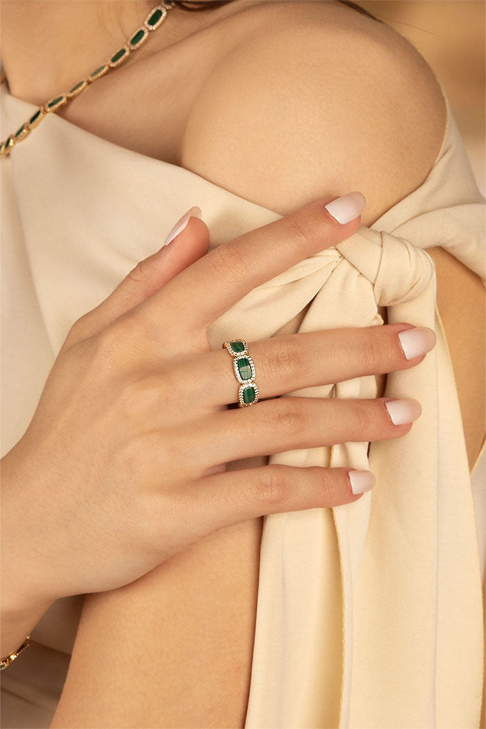 Rings, APM Monaco. Yellow Gold ring with Malachite stone
