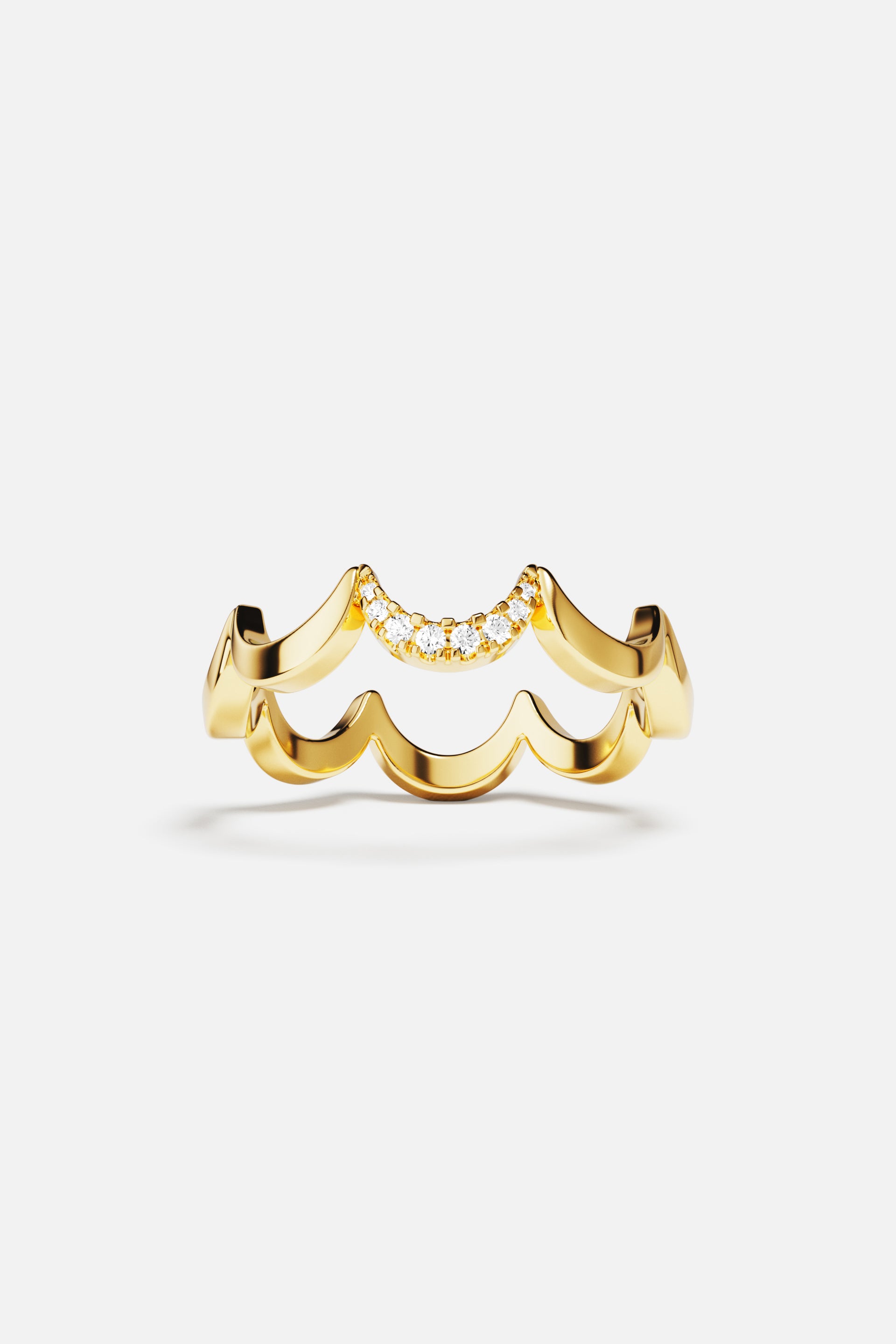 Rings APM Monaco, yellow gold wavy ring with pavé diamonds on top.