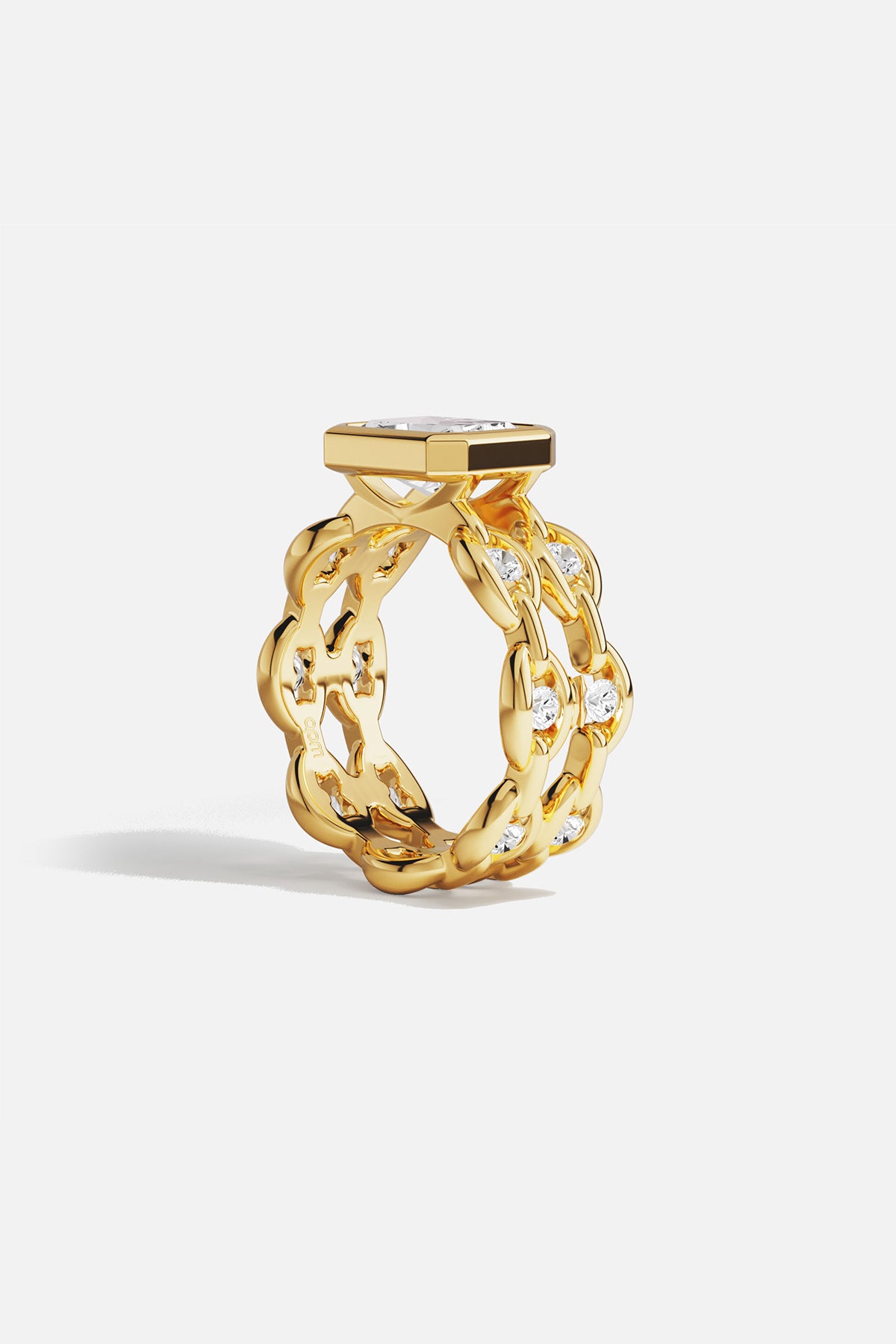 Rings APM Monaco yellow gold statement ring with a large square-cut white center stone surrounded by a pavé halo of smaller stones.