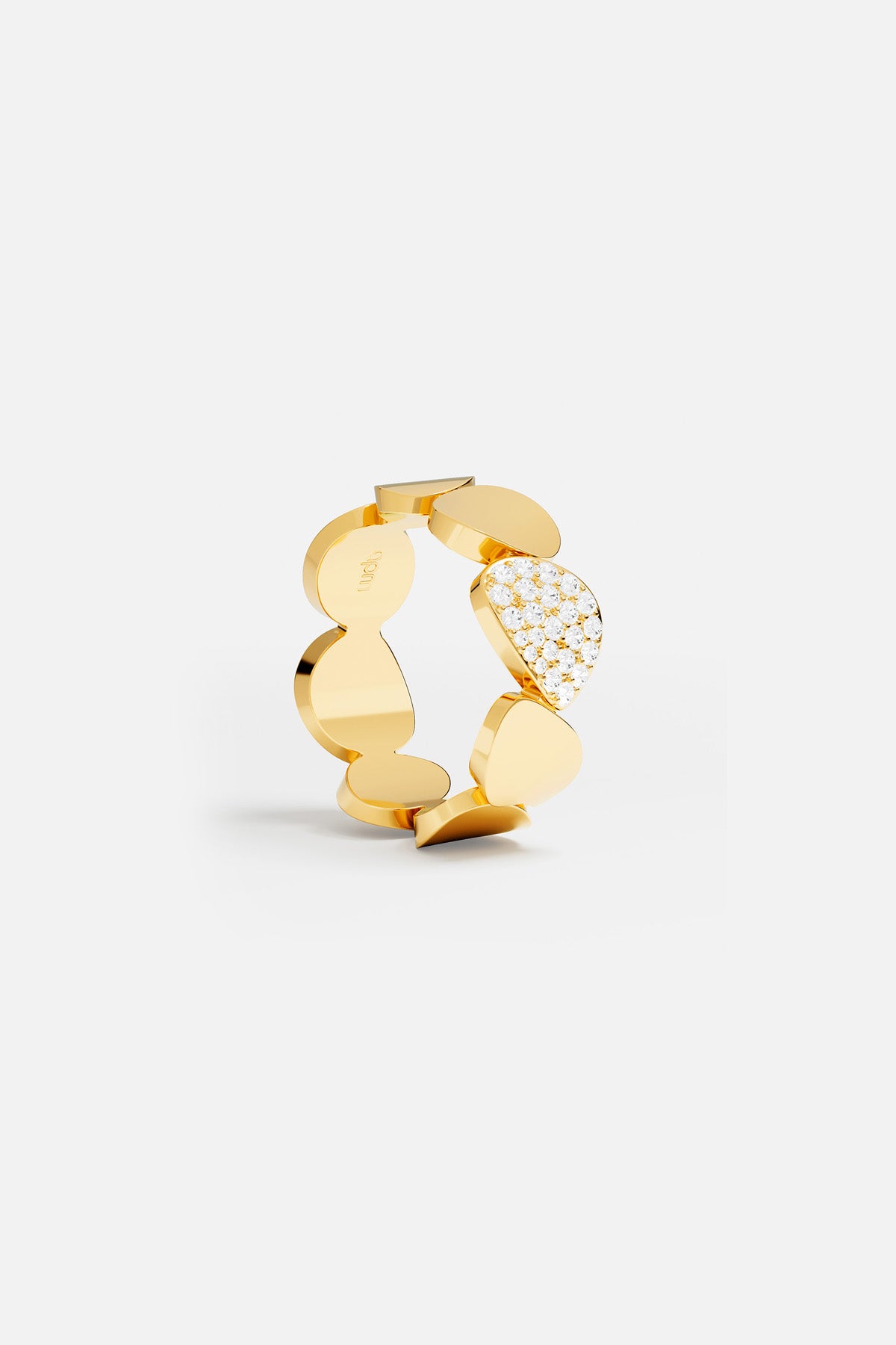 Rings APM Monaco: yellow gold ring with round and irregular segments, one segment pavé-set with white stones.