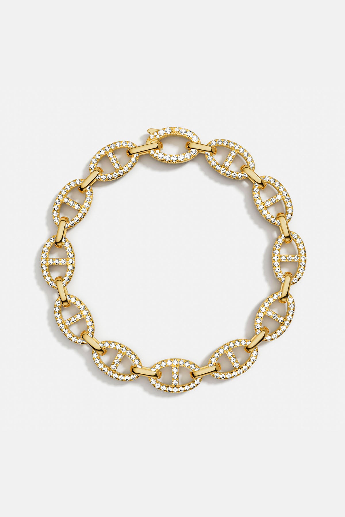 Bracelets APM Monaco: yellow gold chain link bracelet with pavé white cubic zirconia.