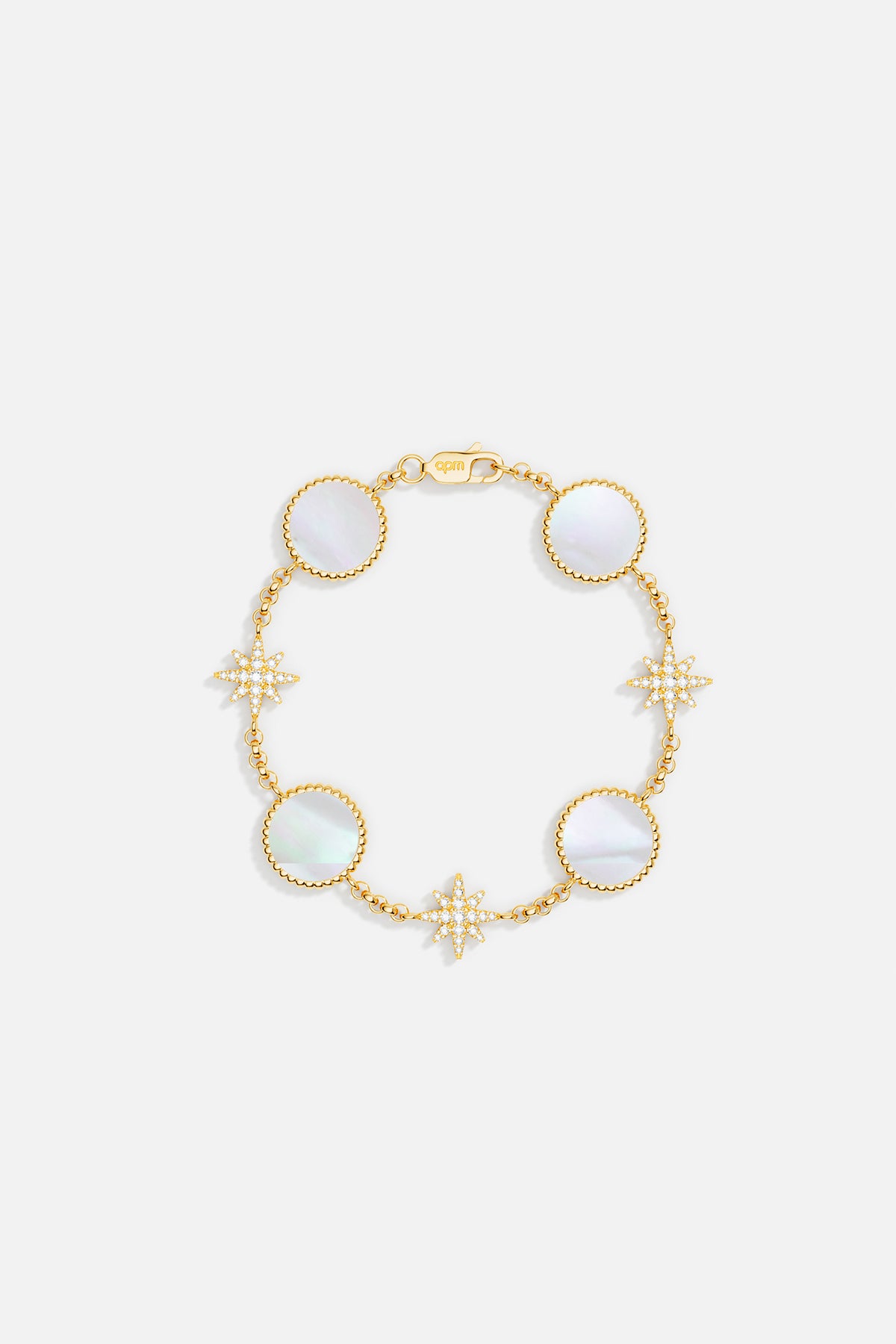 Bracelets APM Monaco: Yellow gold bracelet featuring alternating round nacre medallions and star-shaped diamond stations on a slender chain.