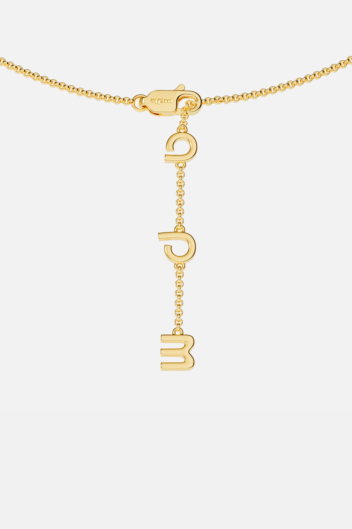 Gold necklace closing on a white background