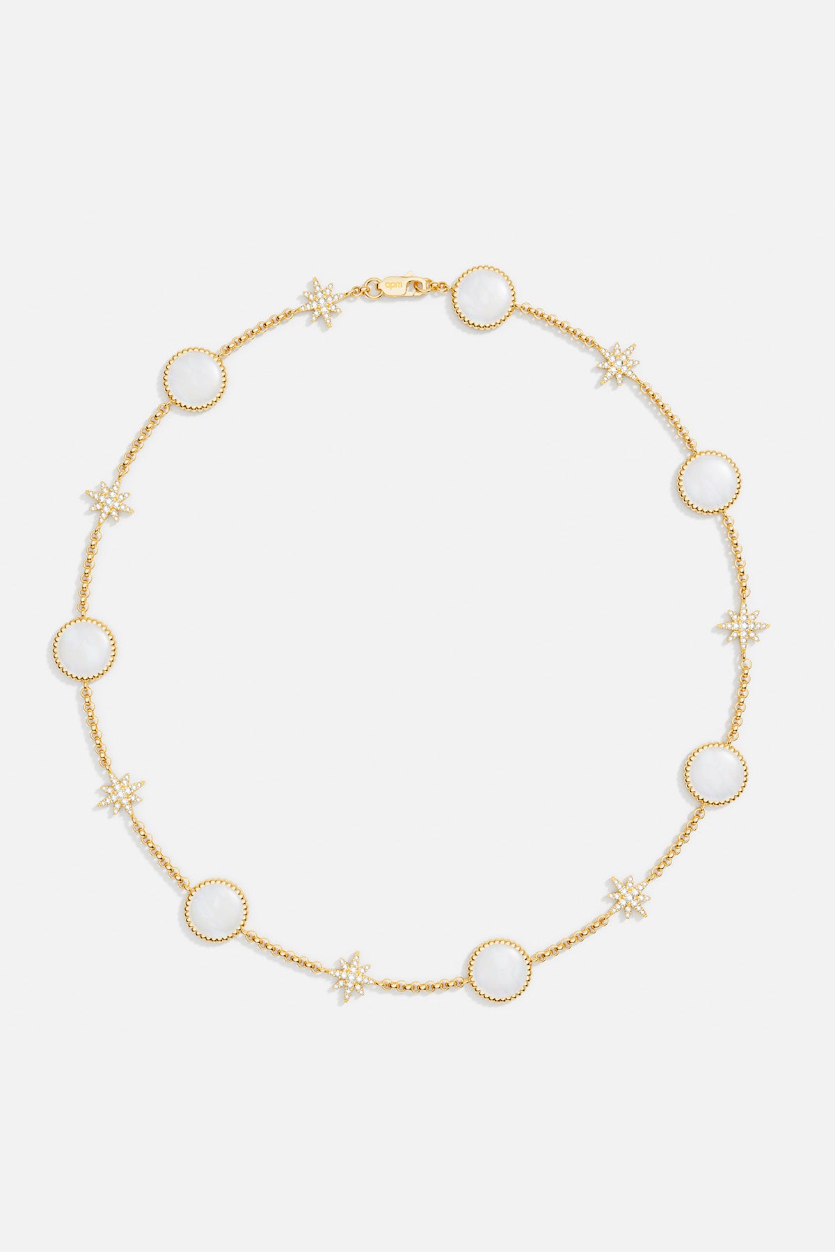 Necklaces APM Monaco: choker with tiny light-yellow beads and round white nacre stones, accented by small white nacre-star shapes.
