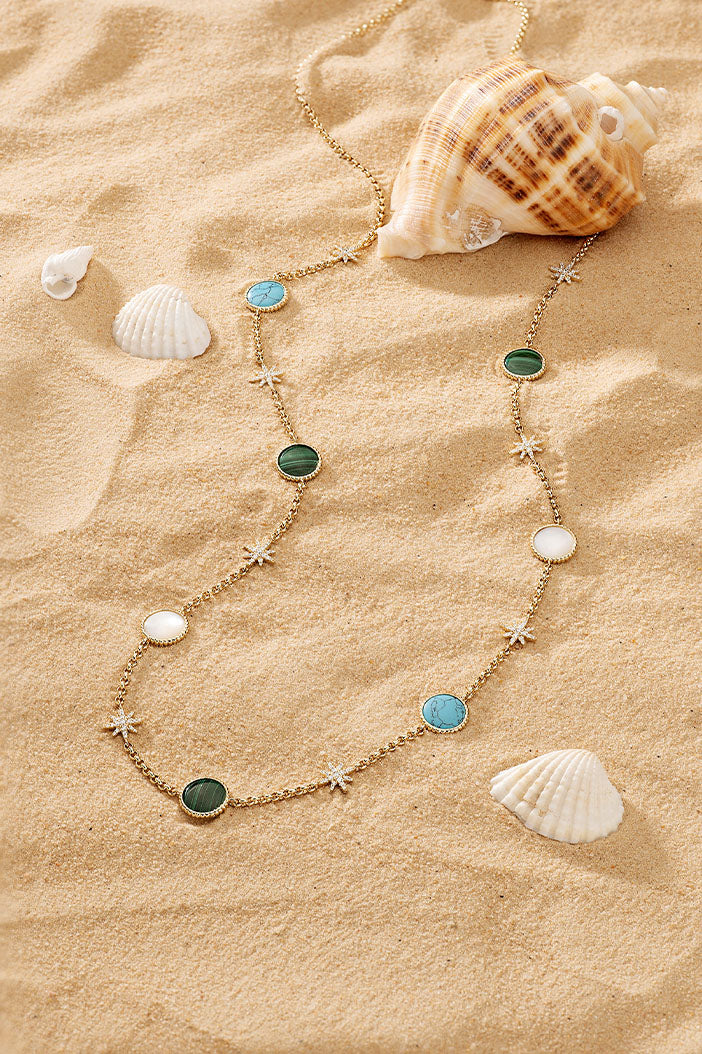 Necklaces APM Monaco, gold-tone adjustable necklace featuring green, white, and turquoise stones.
