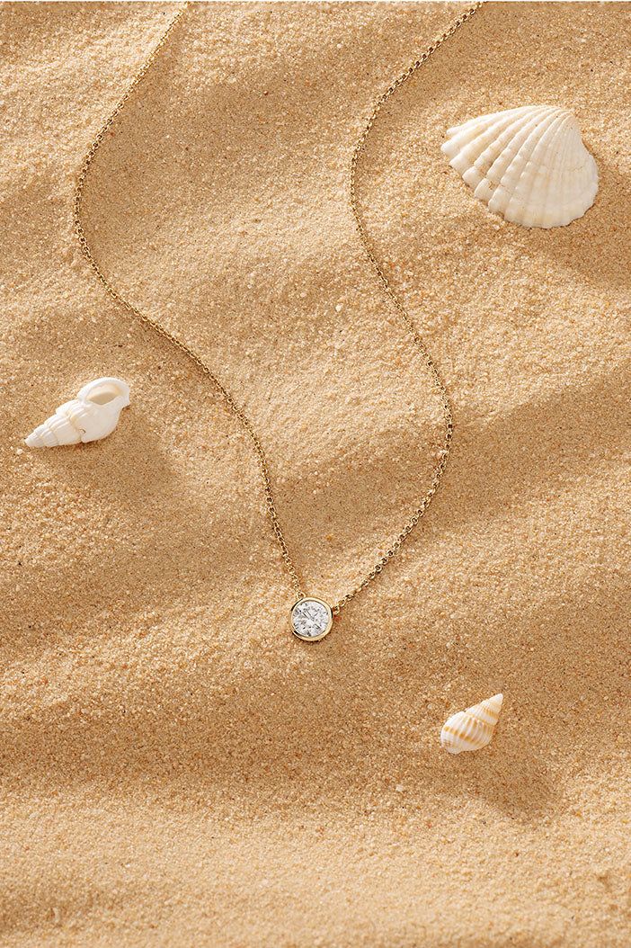 Necklaces APM Monaco, yellow gold adjustable chain with white diamond pendant.