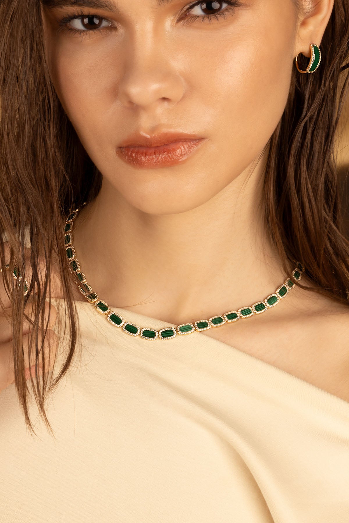 Necklaces APM Monaco short choker and matching Earrings APM Monaco hoop earrings; yellow gold with malachite stones.