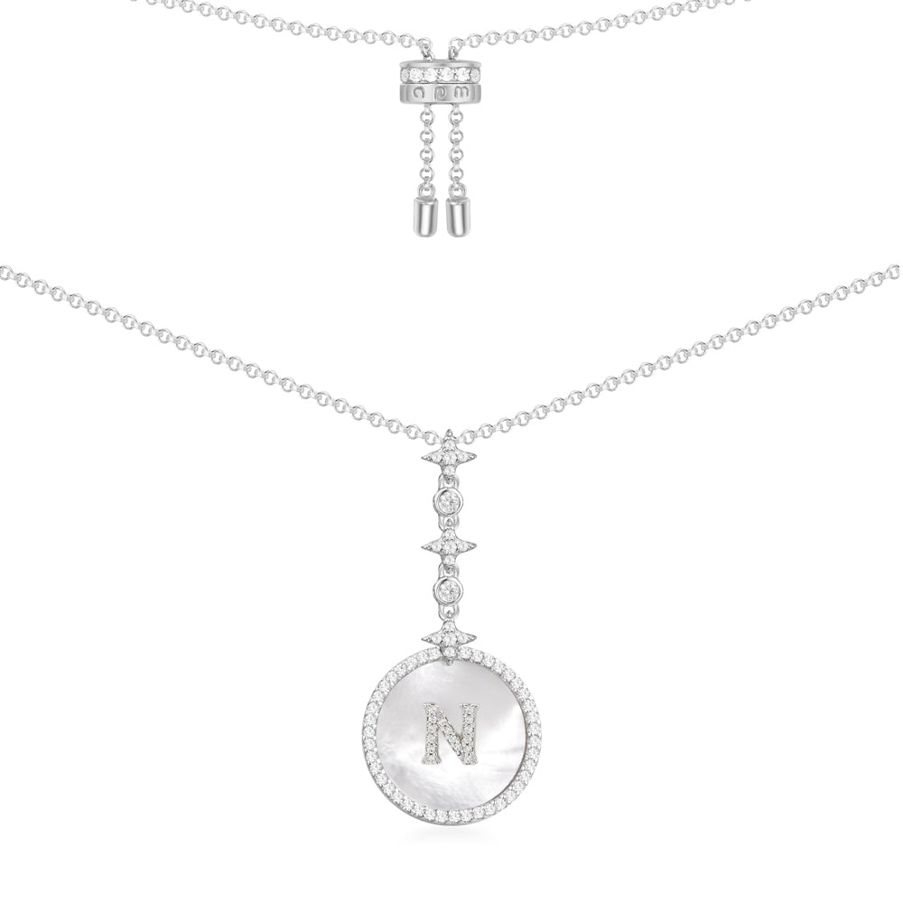 Necklaces APM Monaco white round pendant with letter N on a thin chain.