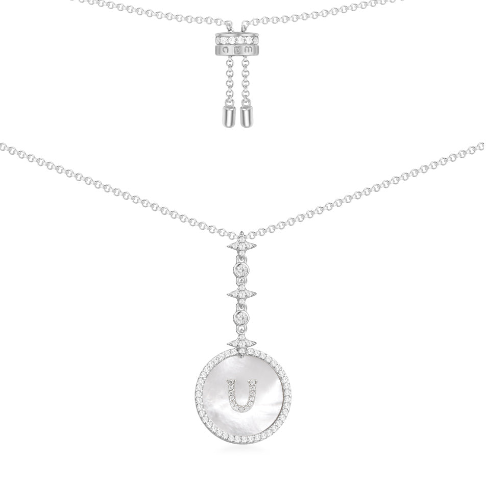 Necklaces APM Monaco. White metal chain necklace with a circular pendant featuring the letter U.