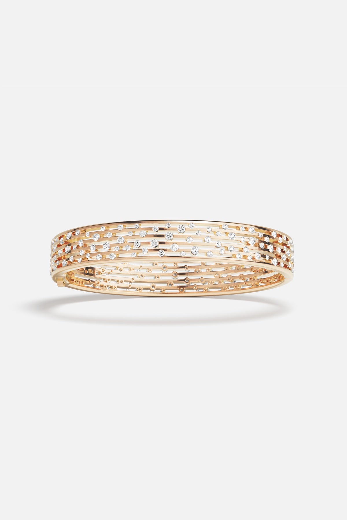 APM Bangle in golden hues, scattered with sparkle, effortlessly radiant.